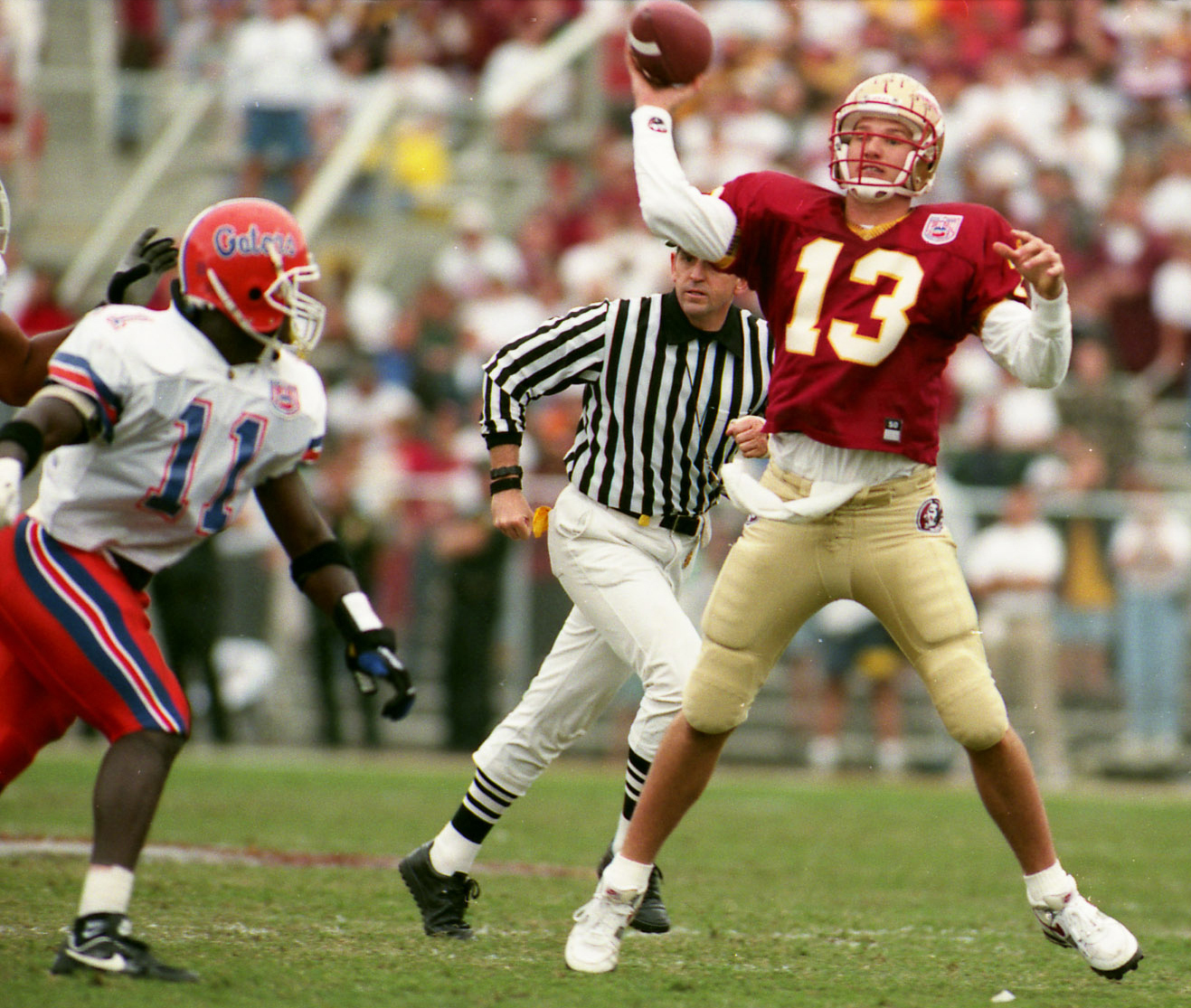 Florida State quarterback Danny Kanell gets a pass off before Florida's Ben Hanks can get to him (Times, 1994) Florida State quarterback Danny Kanell gets a pass off before Florida's Ben Hanks can get to him (Times, 1994)