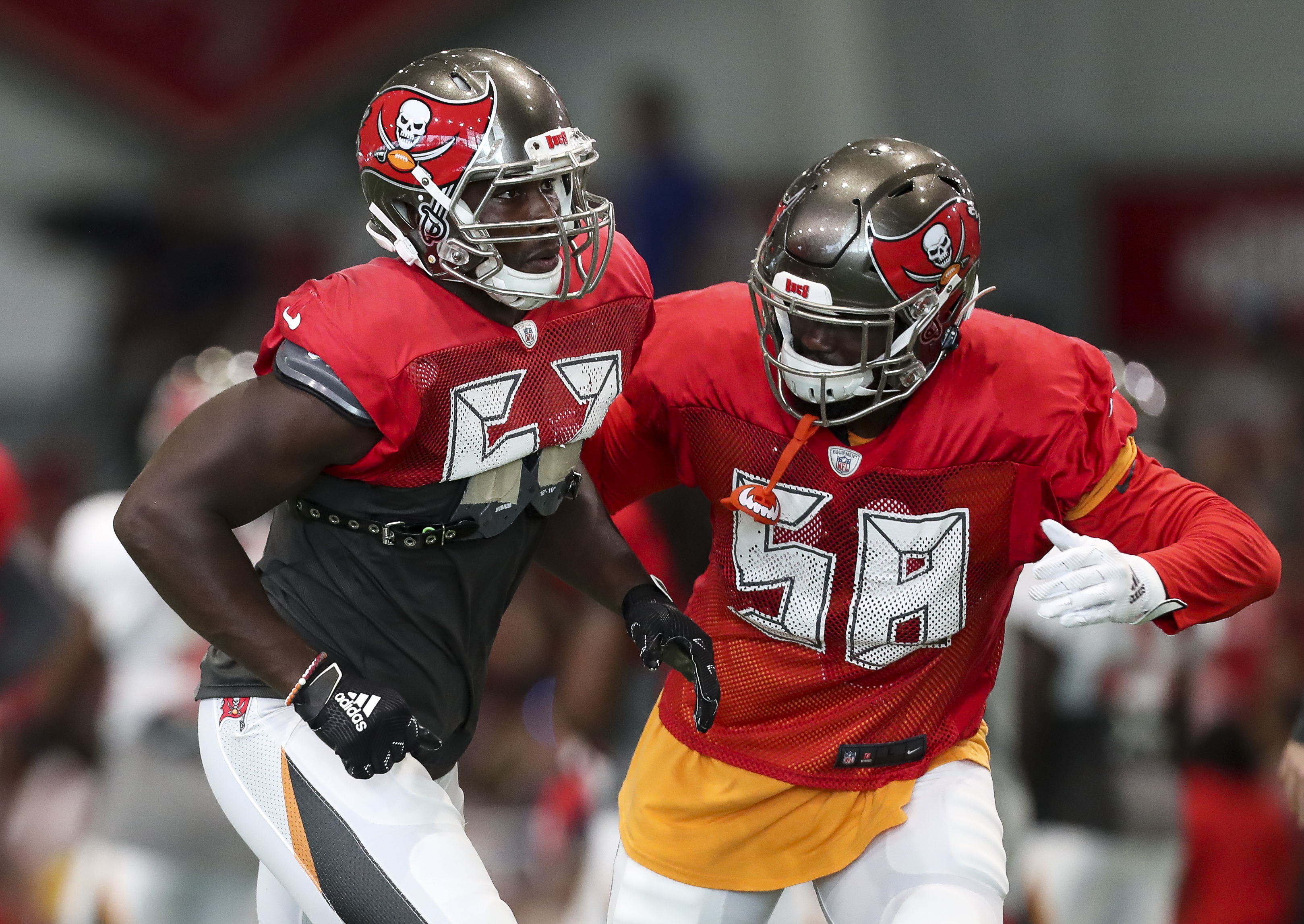 Tampa Bay Buccaneers linebacker Noah Spence (57) and Tampa Bay Buccaneers linebacker Shaquil Barrett (58) run a drill during training camp at the AdventHealth Training Center on August 3, 2019 in Tampa, Florida. MONICA HERNDON | Times Tampa Bay Buccaneers linebacker Noah Spence (57) and Tampa Bay Buccaneers linebacker Shaquil Barrett (58) run a drill during training camp at the AdventHealth Training Center on August 3, 2019 in Tampa, Florida. MONICA HERNDON | Times