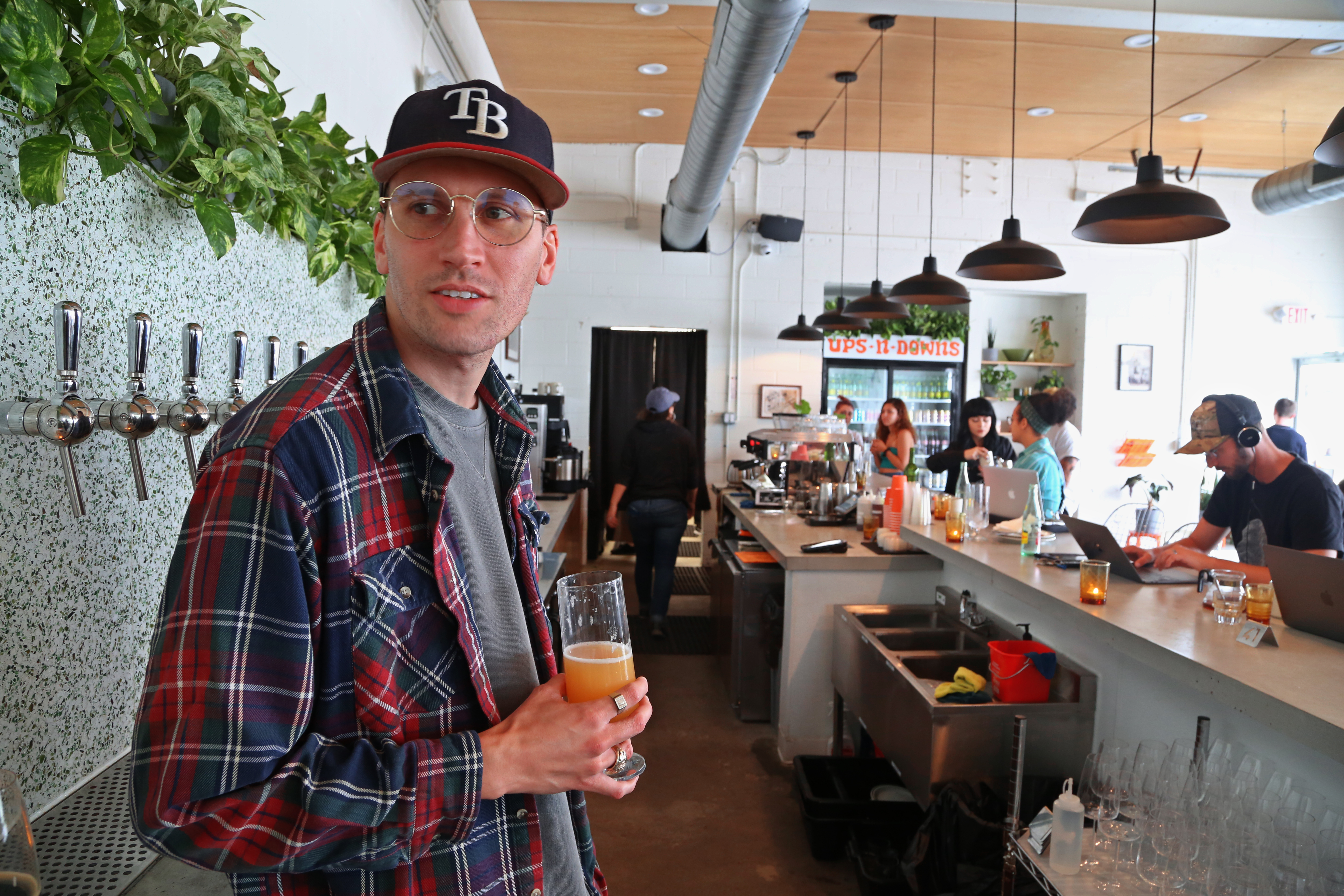 King State co-owner Nate Young holds a beer at the new spot in Tampa. SCOTT KEELER | Times | Tampa Bay Times King State co-owner Nate Young holds a beer at the new spot in Tampa. SCOTT KEELER | Times | Tampa Bay Times