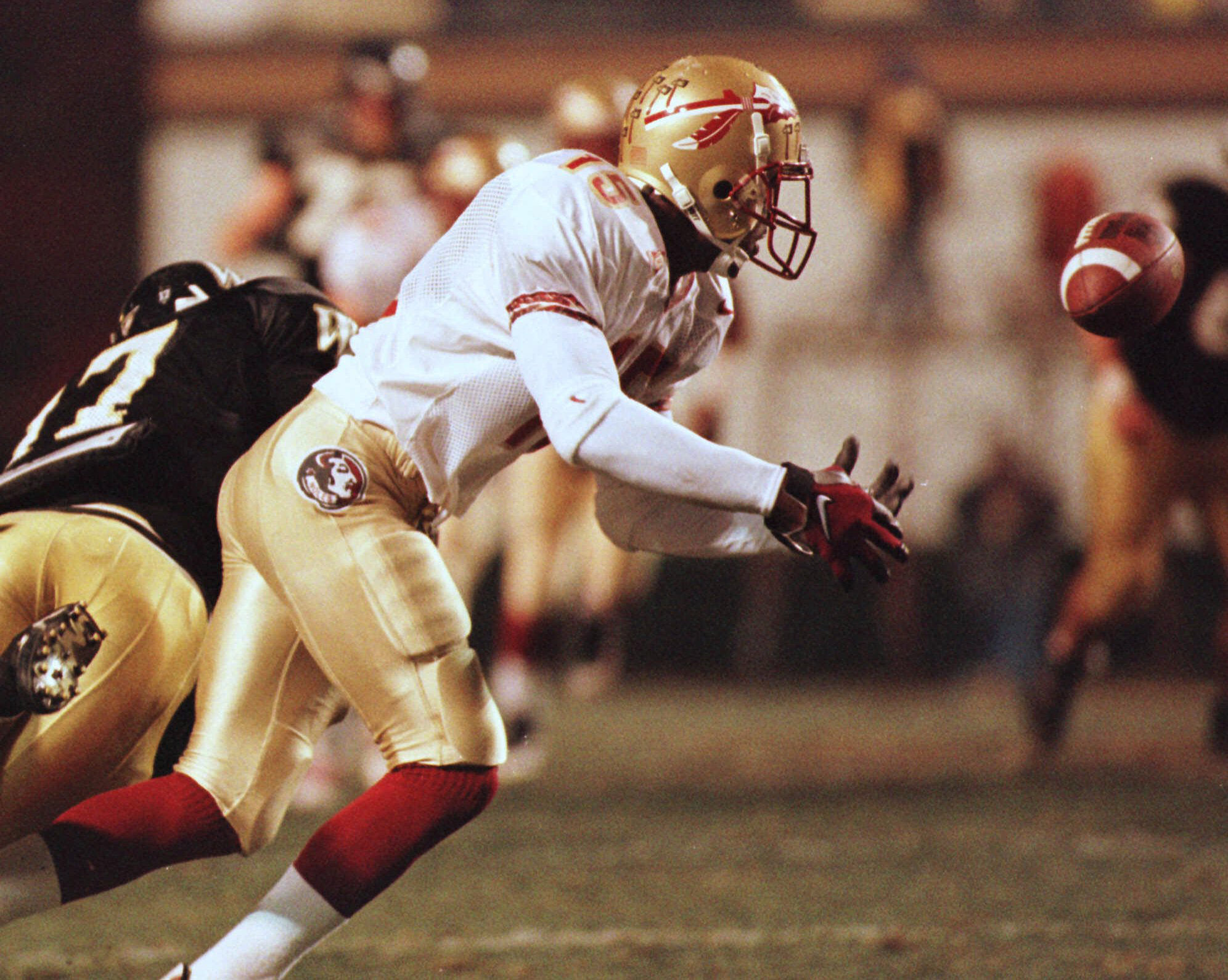 Florida State's Mario Edwards (15) reaches for an interception past Wake Forest's Marvin Chalmers (17) in the Seminoles' 24-7 win at Groves Stadium in Winston-Salem, N.C., Saturday, Nov. 14, 1998. Edwards had four interceptions in the game, an ACC record.(AP Photo/Tom Copeland) Florida State's Mario Edwards (15) reaches for an interception past Wake Forest's Marvin Chalmers (17) in the Seminoles' 24-7 win at Groves Stadium in Winston-Salem, N.C., Saturday, Nov. 14, 1998. Edwards had four interceptions in the game, an ACC record.(AP Photo/Tom Copeland)