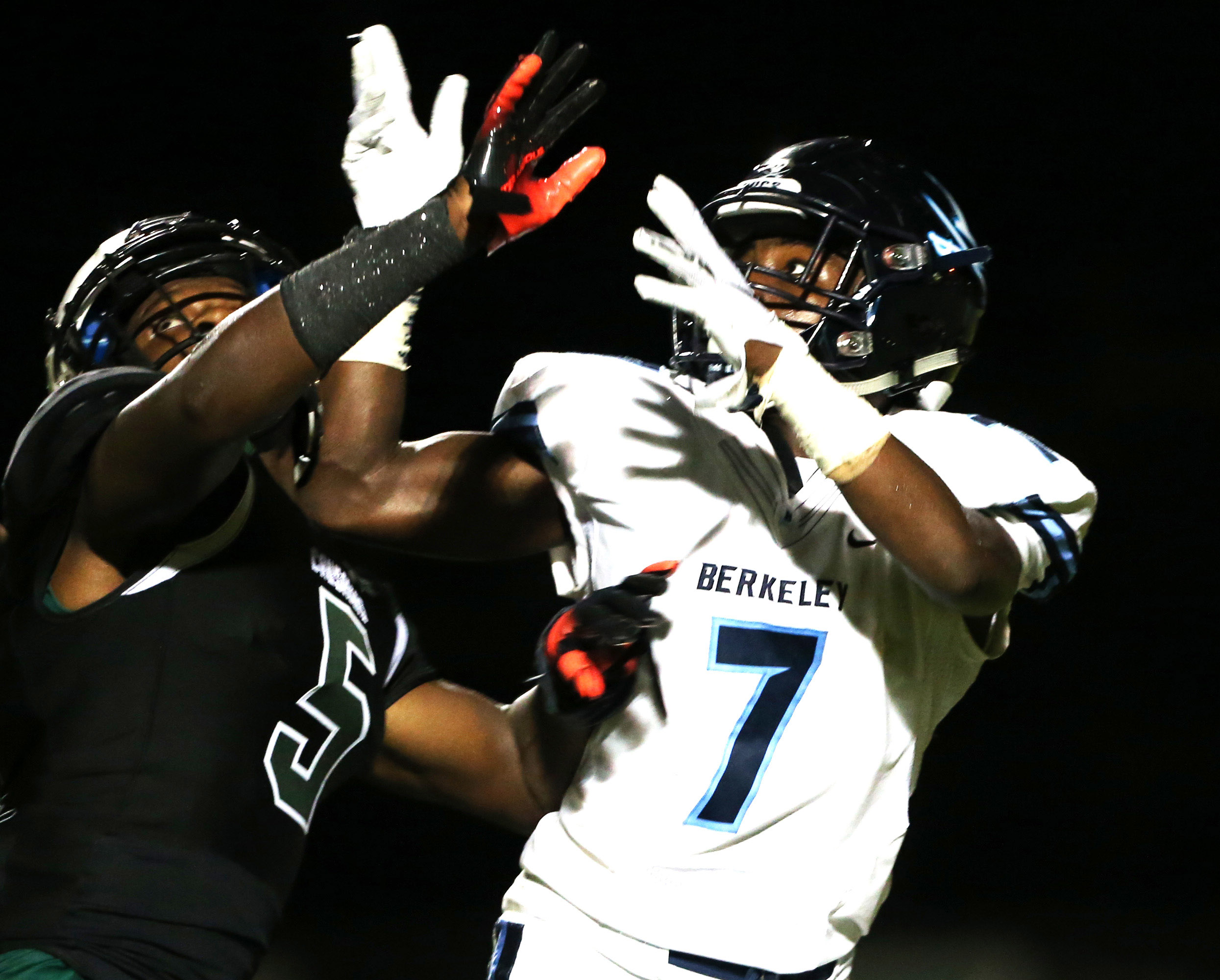 Berkeley Prep's Xavier Townsend (7) and Tampa Catholic's Deangelo Taylor (5) battle for a pass during last season's matchup. Tampa Bay Times Berkeley Prep's Xavier Townsend (7) and Tampa Catholic's Deangelo Taylor (5) battle for a pass during last season's matchup. Tampa Bay Times