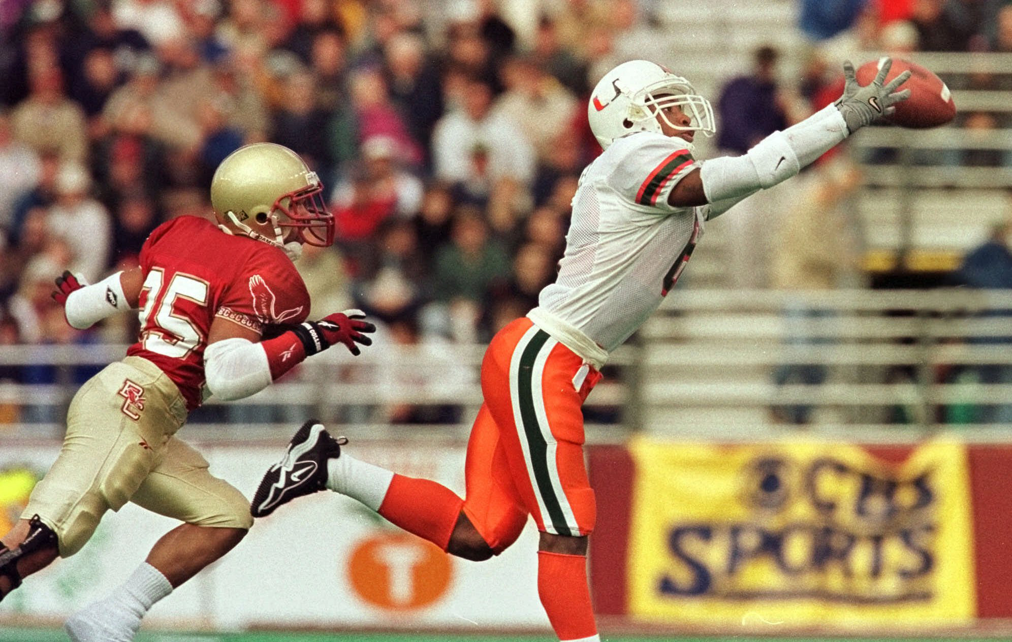 University of Miami wide receiver Santana Moss (6) get his hands on the Kenny Kelly pass and an extra step on Boston College's D. J. Sutton during an Oct. 23, 1999, game. (AP Photo/Jim Rogash) University of Miami wide receiver Santana Moss (6) get his hands on the Kenny Kelly pass and an extra step on Boston College's D. J. Sutton during an Oct. 23, 1999, game. (AP Photo/Jim Rogash)