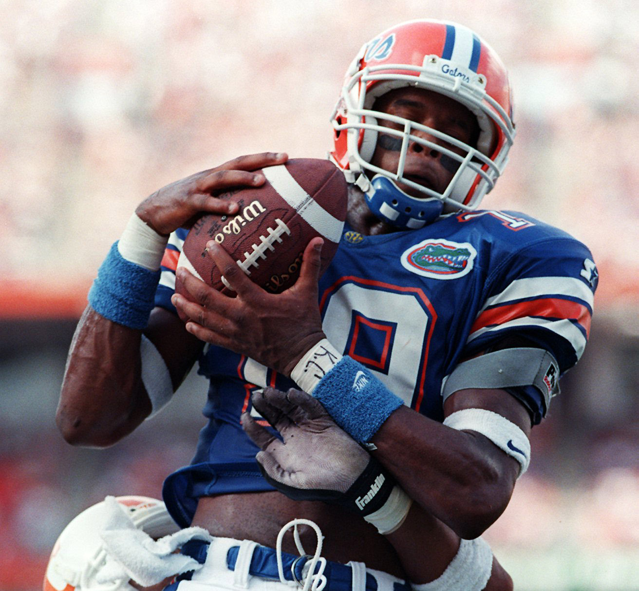 Florida's Ike Hilliard makes the catch as a Tennessee defender wraps him up. (Times, 1995) Florida's Ike Hilliard makes the catch as a Tennessee defender wraps him up. (Times, 1995)