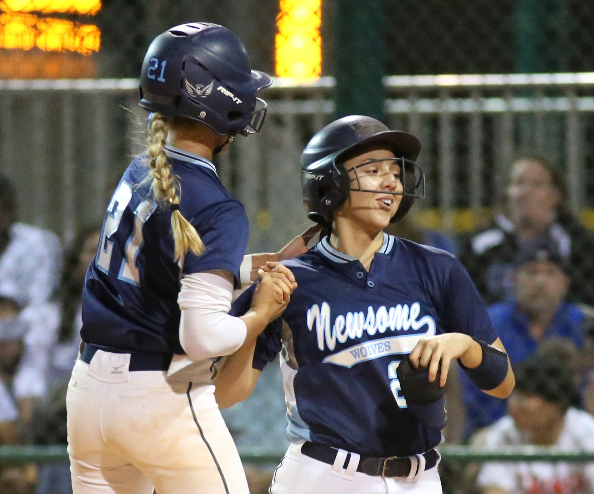 Newsome leadoff hitter Bailee Leisti, left, gives Lindsey Harper a pat on the back moments after Harper collects the first hit of the Class 9A state final. (SCOTT PURKS | Special to the Times) Newsome leadoff hitter Bailee Leisti, left, gives Lindsey Harper a pat on the back moments after Harper collects the first hit of the Class 9A state final. (SCOTT PURKS | Special to the Times)