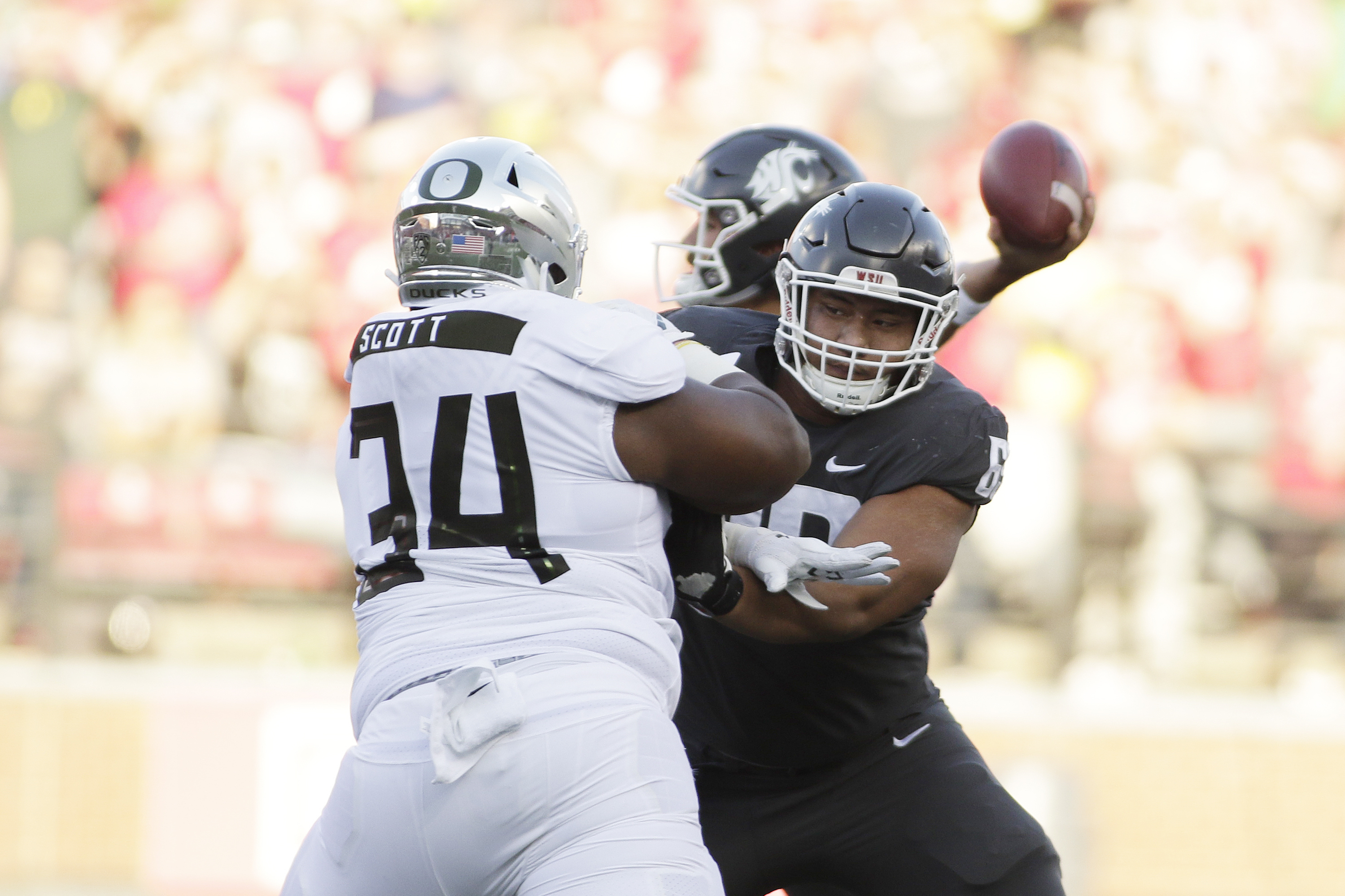 Washington State offensive lineman Frederick Mauigoa, right, blocks Oregon defensive lineman Jordon Scott (34) during an Oct. 20 game. Young Kwak | AP Washington State offensive lineman Frederick Mauigoa, right, blocks Oregon defensive lineman Jordon Scott (34) during an Oct. 20 game. Young Kwak | AP