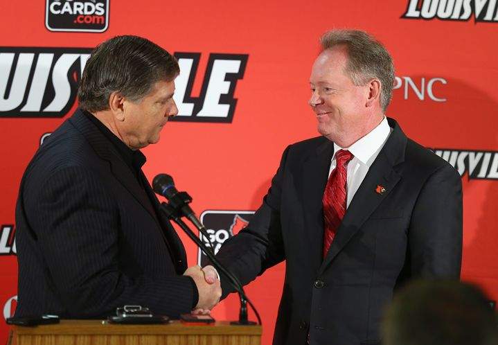 Welcome back: Louisville athletic director Tom Jurich, left, shakes hands with Bobby Petrino, who officially begins his second stint as coach. Welcome back: Louisville athletic director Tom Jurich, left, shakes hands with Bobby Petrino, who officially begins his second stint as coach.