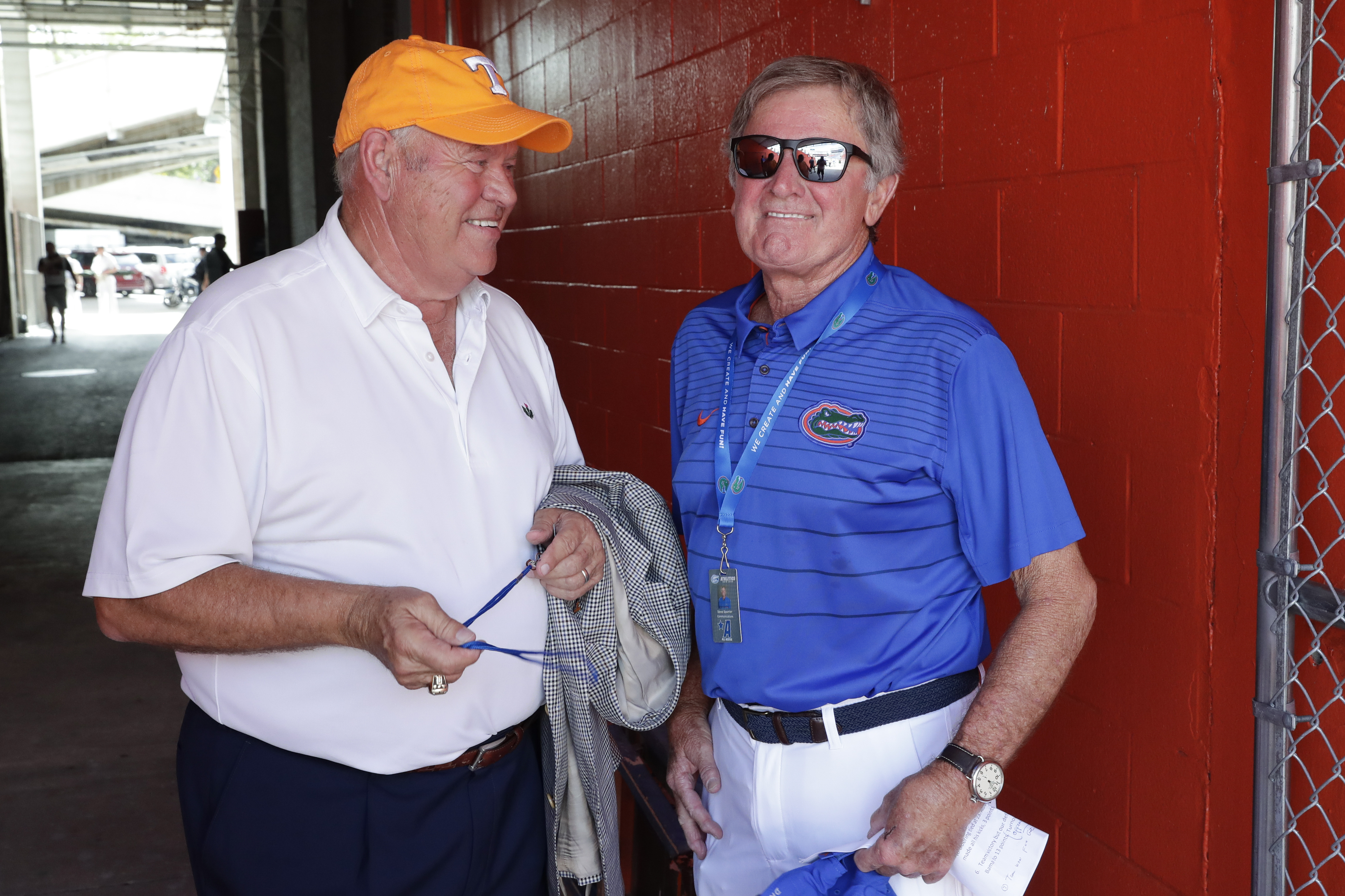 Former Tennessee coach and current athletic director Phillip Fulmer, left, talks with former Florida head coach Steve Spurrier. John Raoux | AP Former Tennessee coach and current athletic director Phillip Fulmer, left, talks with former Florida head coach Steve Spurrier. John Raoux | AP