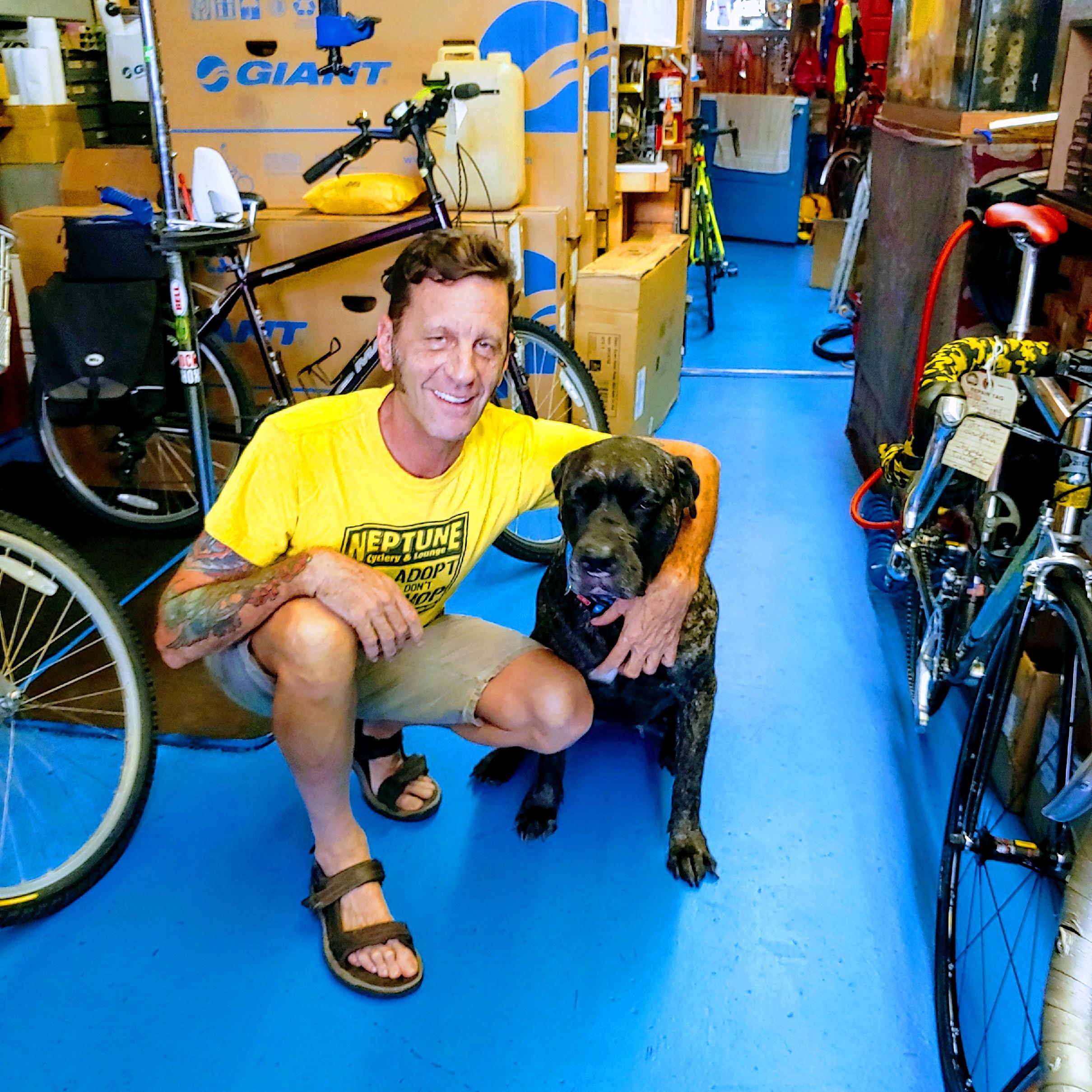 Eddie Mullally poses with Boots at Neptune Cyclery and Lounge. Courtesy of Eddie Mullally Eddie Mullally poses with Boots at Neptune Cyclery and Lounge. Courtesy of Eddie Mullally