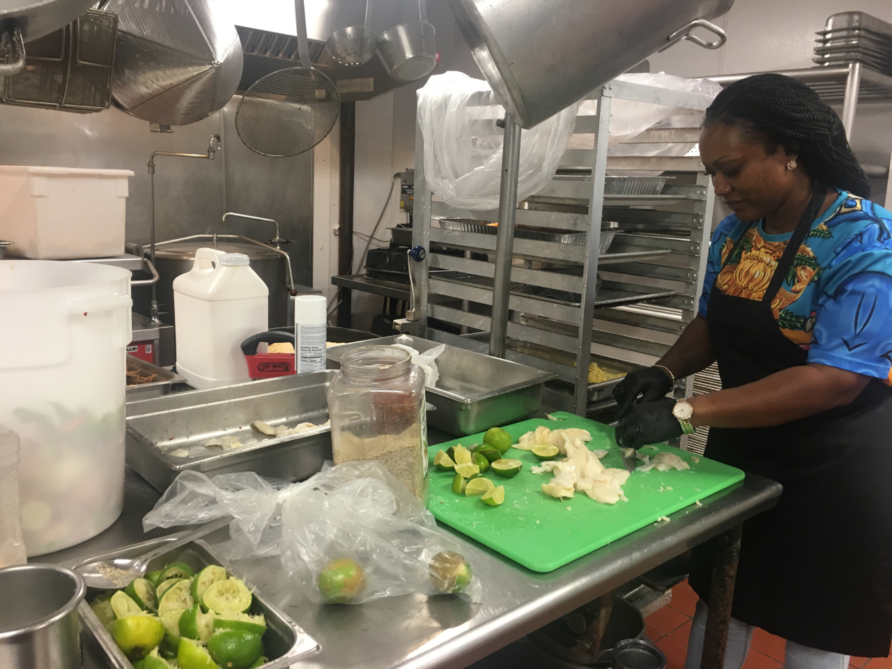 Brianelle Cartwright, a 35-year-old Saint Leo University health care administration sophomore, helps prepare conk for the university's Bahamian dinner Tuesday night. Brianelle Cartwright, a 35-year-old Saint Leo University health care administration sophomore, helps prepare conk for the university's Bahamian dinner Tuesday night.