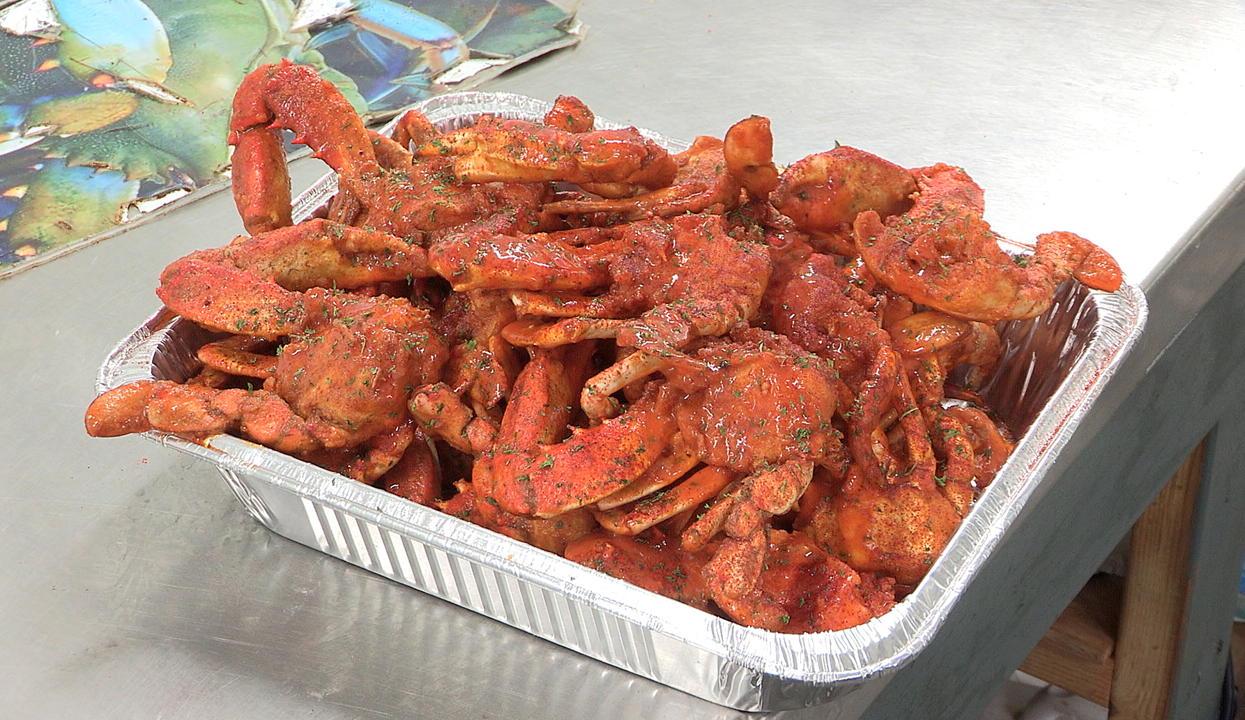 One of Emmanuel Hagins more original dishes is fried blue crab coated in a buffalo wing sauce. It's a hot seller at Tampa Blue Crab & Seafood on Hillsborough Ave. JAMES BORCHUCK | Times One of Emmanuel Hagins more original dishes is fried blue crab coated in a buffalo wing sauce. It's a hot seller at Tampa Blue Crab & Seafood on Hillsborough Ave. JAMES BORCHUCK | Times