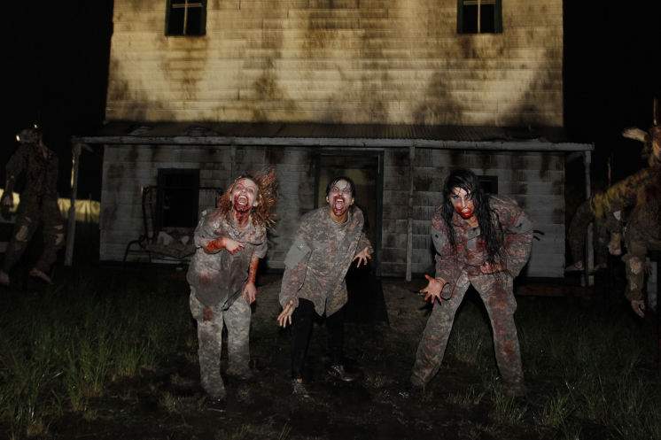 Actors emerge from a simulated farmhouse at the center of the Infected haunted house at Scream-A-Geddon in Dade City. Luis Santana | Tampa Bay Times Actors emerge from a simulated farmhouse at the center of the Infected haunted house at Scream-A-Geddon in Dade City. Luis Santana | Tampa Bay Times