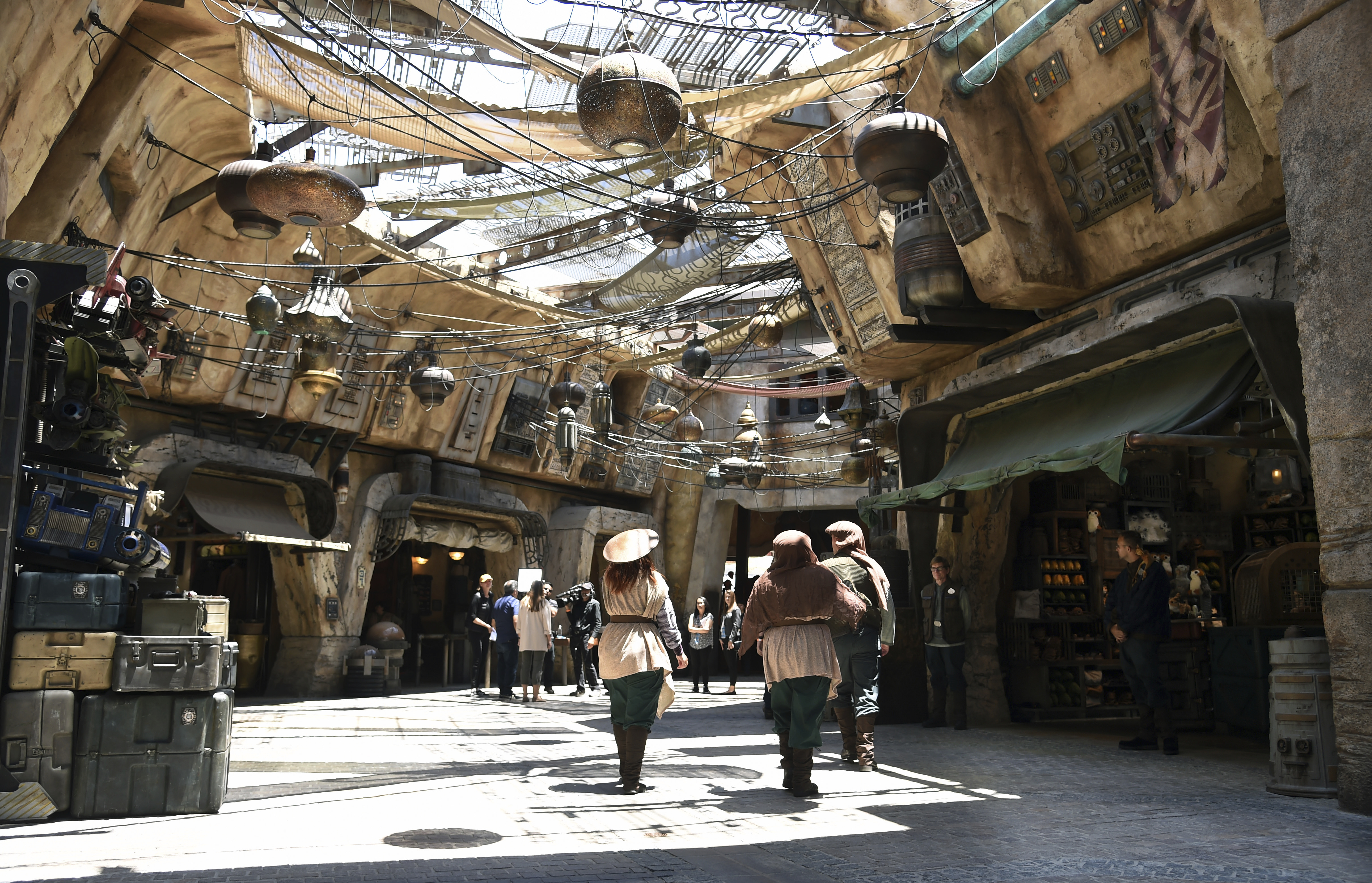 Characters stroll through the marketplace at the Black Spire Outpost during the Star Wars: Galaxy's Edge media preview at Disneyland on Anaheim, Calif., in May. Chris Pizzello | Chris Pizzello/Invision/AP Characters stroll through the marketplace at the Black Spire Outpost during the Star Wars: Galaxy's Edge media preview at Disneyland on Anaheim, Calif., in May. Chris Pizzello | Chris Pizzello/Invision/AP