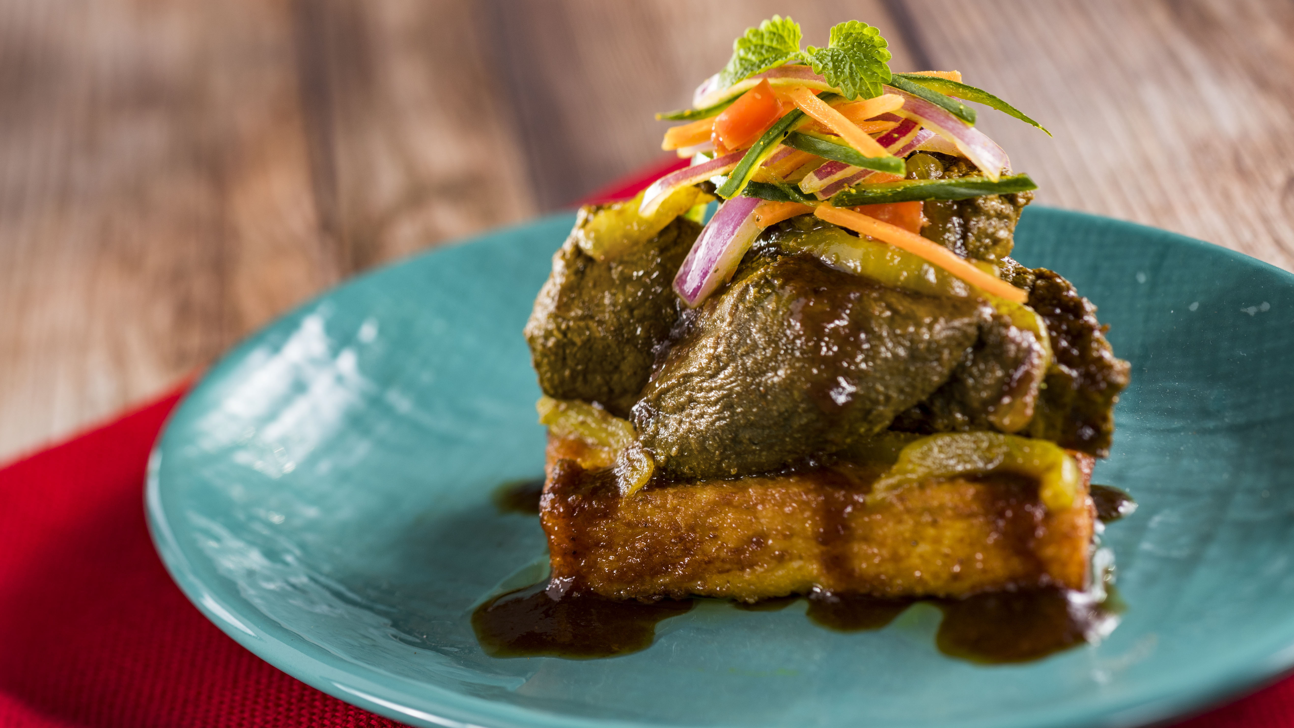 Kenyan coffee barbecue beef tenderloin with sweet potato and corn mealie pap and kachumbari slaw is served at the Africa marketplace. Walt Disney World Kenyan coffee barbecue beef tenderloin with sweet potato and corn mealie pap and kachumbari slaw is served at the Africa marketplace. Walt Disney World