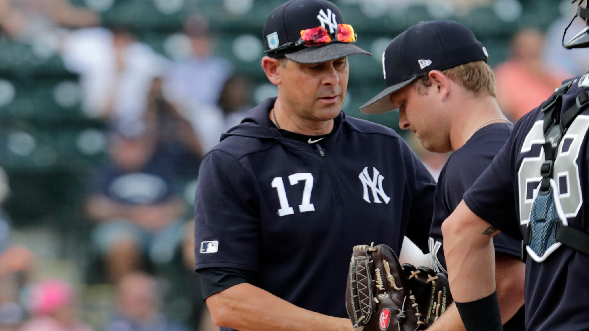 New York Yankees manager Aaron Boone, left, takes the ball from starting pitcher Chance Adams as he is relieved in the first inning during a spring training baseball game against the Detroit Tigers, Wednesday, Feb. 27, 2019, in Lakeland, Fla. (AP Photo/Lynne Sladky) New York Yankees manager Aaron Boone, left, takes the ball from starting pitcher Chance Adams as he is relieved in the first inning during a spring training baseball game against the Detroit Tigers, Wednesday, Feb. 27, 2019, in Lakeland, Fla. (AP Photo/Lynne Sladky)