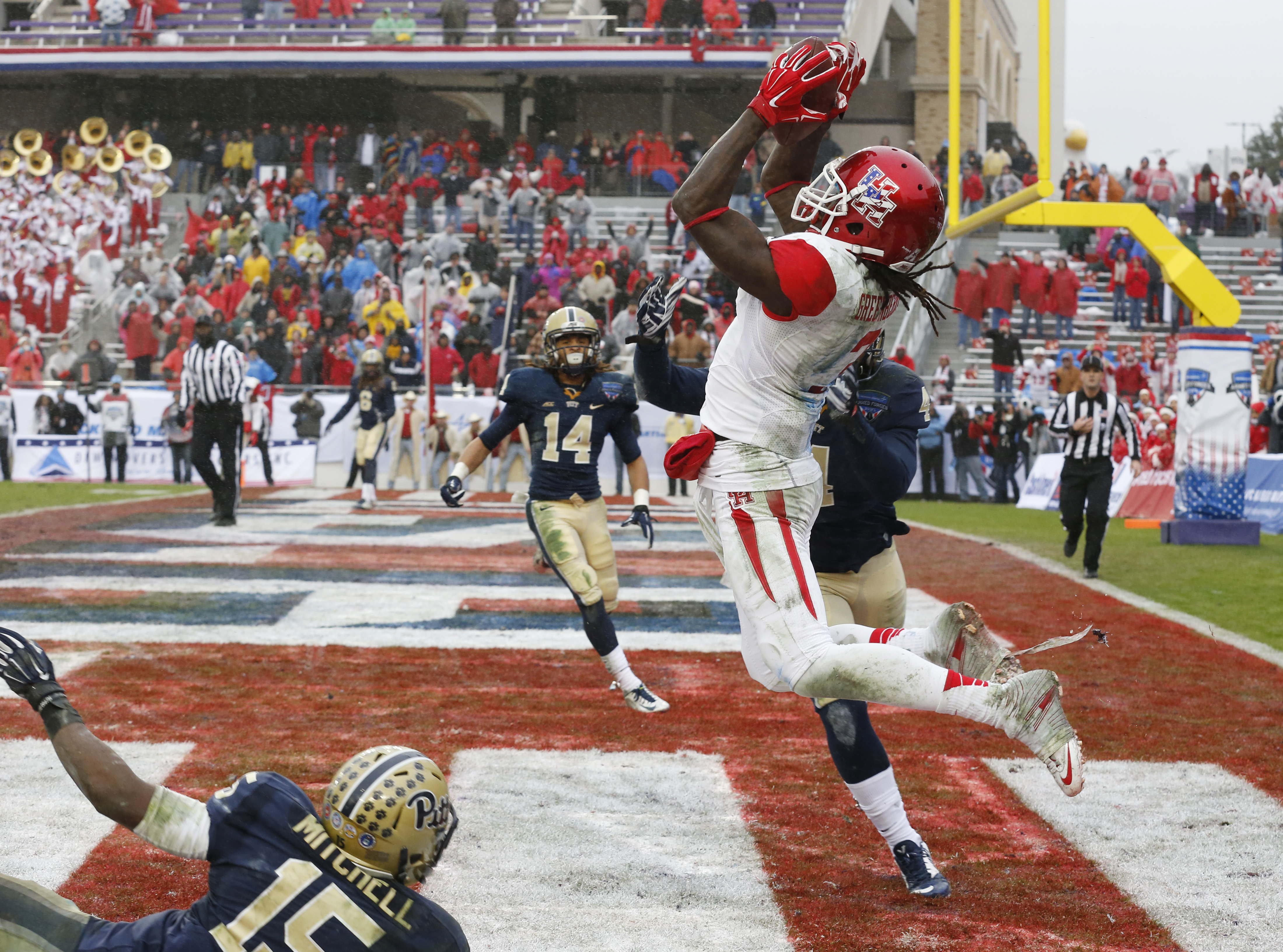 In this Jan. 2, 2015, file photo, Pittsburgh defensive back Reggie Mitchell (15) and linebacker Bam Bradley defend as Houston wide receiver Deontay Greenberry (3) catches the game-winning two-point conversion late in the second half of the Armed Forces Bowl NCAA college football game in Fort Worth, Texas. Sharon Ellman | AP In this Jan. 2, 2015, file photo, Pittsburgh defensive back Reggie Mitchell (15) and linebacker Bam Bradley defend as Houston wide receiver Deontay Greenberry (3) catches the game-winning two-point conversion late in the second half of the Armed Forces Bowl NCAA college football game in Fort Worth, Texas. Sharon Ellman | AP