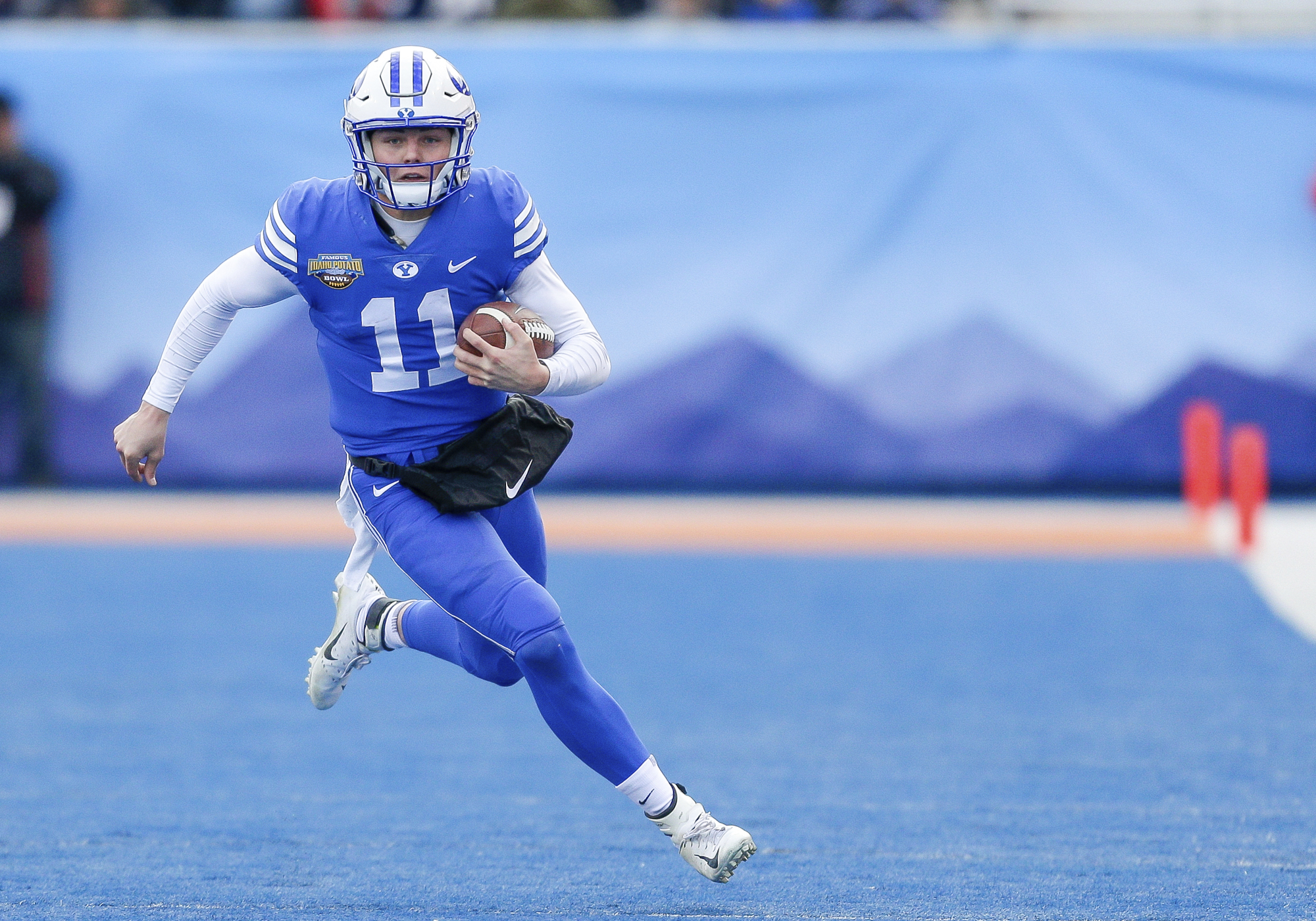 BYU quarterback Zach Wilson (11) runs against Western Michigan in last season's Famous Idaho Potato Bowl in Boise, Idaho. BYU won, 49-18. Steve Conner | AP BYU quarterback Zach Wilson (11) runs against Western Michigan in last season's Famous Idaho Potato Bowl in Boise, Idaho. BYU won, 49-18. Steve Conner | AP