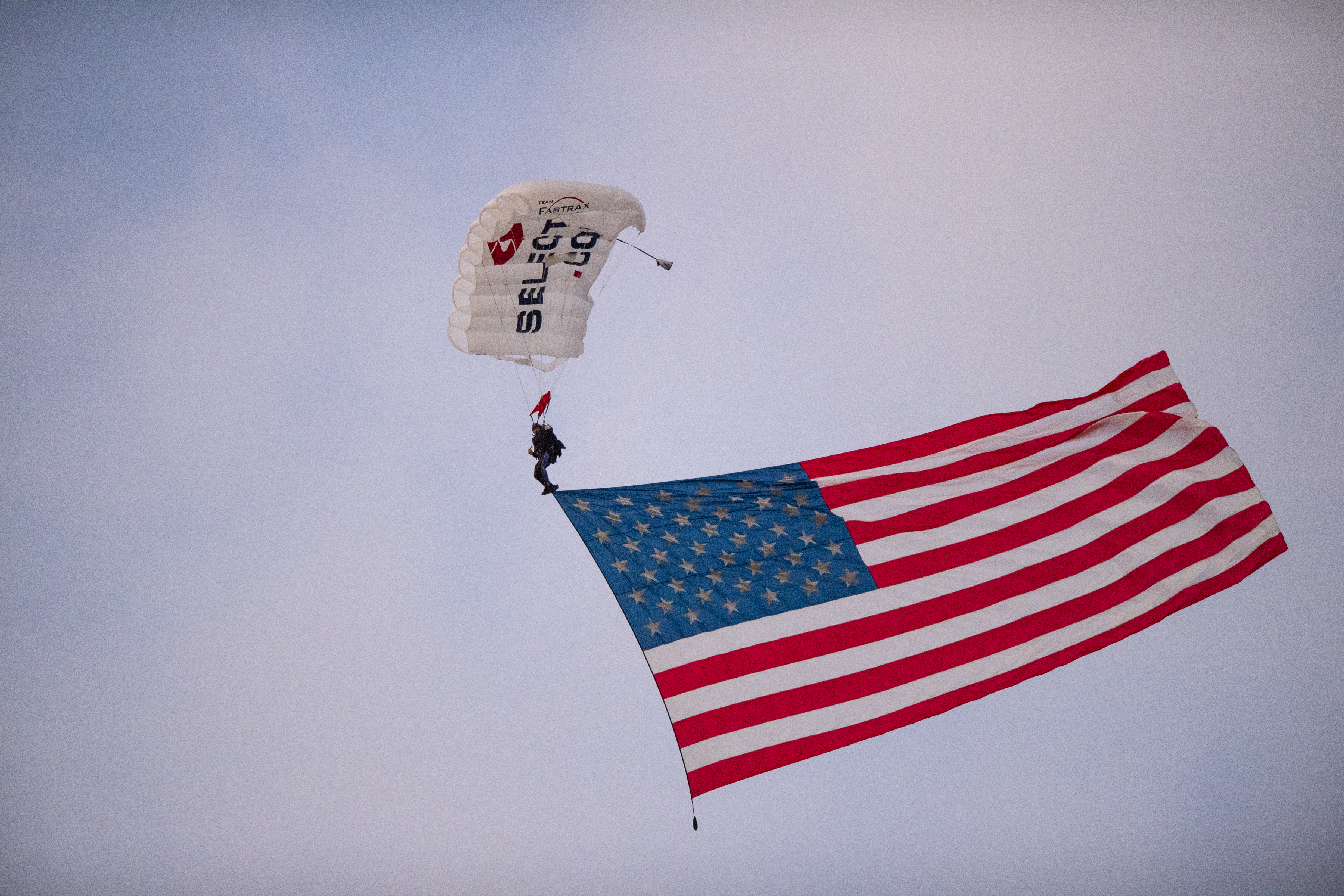 The American flag arrives via skydiver at Memorial Stadium during the National Anthem before an NCAA college football game between Indiana and Northwestern. Doug McSchooler | AP The American flag arrives via skydiver at Memorial Stadium during the National Anthem before an NCAA college football game between Indiana and Northwestern. Doug McSchooler | AP