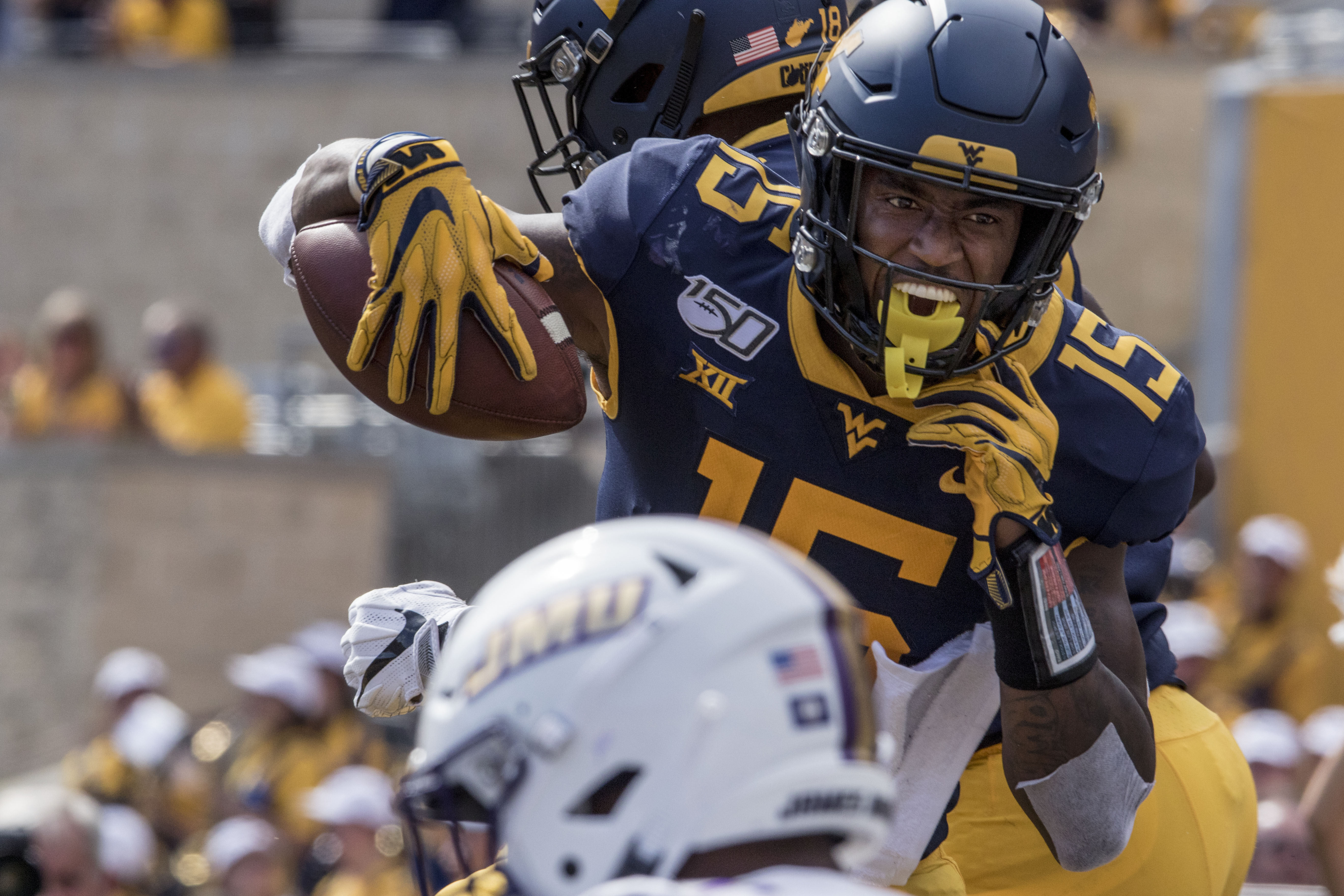 West Virginia wide receiver George Campbell (15) celebrates with teammates after catching a touchdown pass during the second half of an NCAA college football game against James Madison Saturday, Aug. 31, 2019, in Morgantown, W.Va. Ray Thompson | AP West Virginia wide receiver George Campbell (15) celebrates with teammates after catching a touchdown pass during the second half of an NCAA college football game against James Madison Saturday, Aug. 31, 2019, in Morgantown, W.Va. Ray Thompson | AP