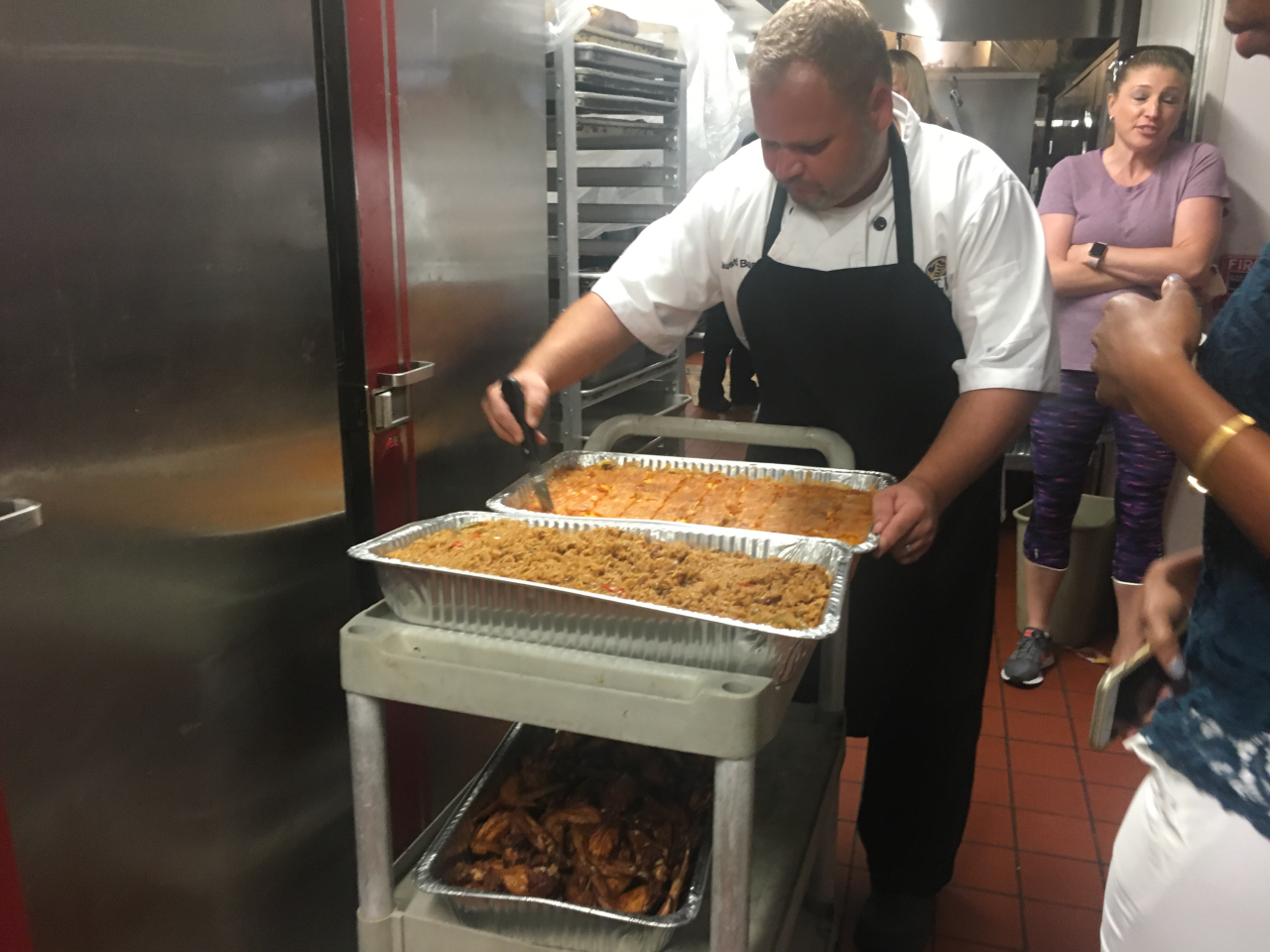 Saint Leo University executive chief and interim director of dinning services Justin Bush helps prepare Bahamian meals on Tuesday. The university hosted a dinner to support its Bahamian student population. Paige Fry | Paige Fry Saint Leo University executive chief and interim director of dinning services Justin Bush helps prepare Bahamian meals on Tuesday. The university hosted a dinner to support its Bahamian student population. Paige Fry | Paige Fry