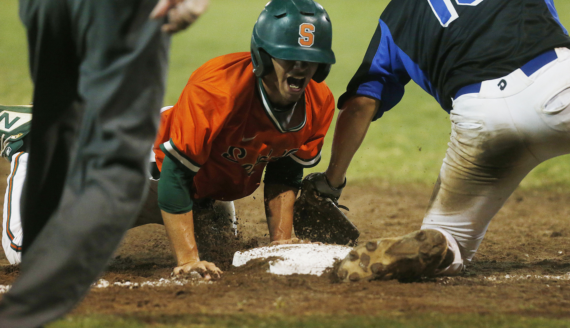 Seminole's Brian Hollingsworth steals third base while avoiding the tag by East Lake's Opie Parker during the Class 8A-7 district title game. (OCTAVIO JONES | Times) Seminole's Brian Hollingsworth steals third base while avoiding the tag by East Lake's Opie Parker during the Class 8A-7 district title game. (OCTAVIO JONES | Times)