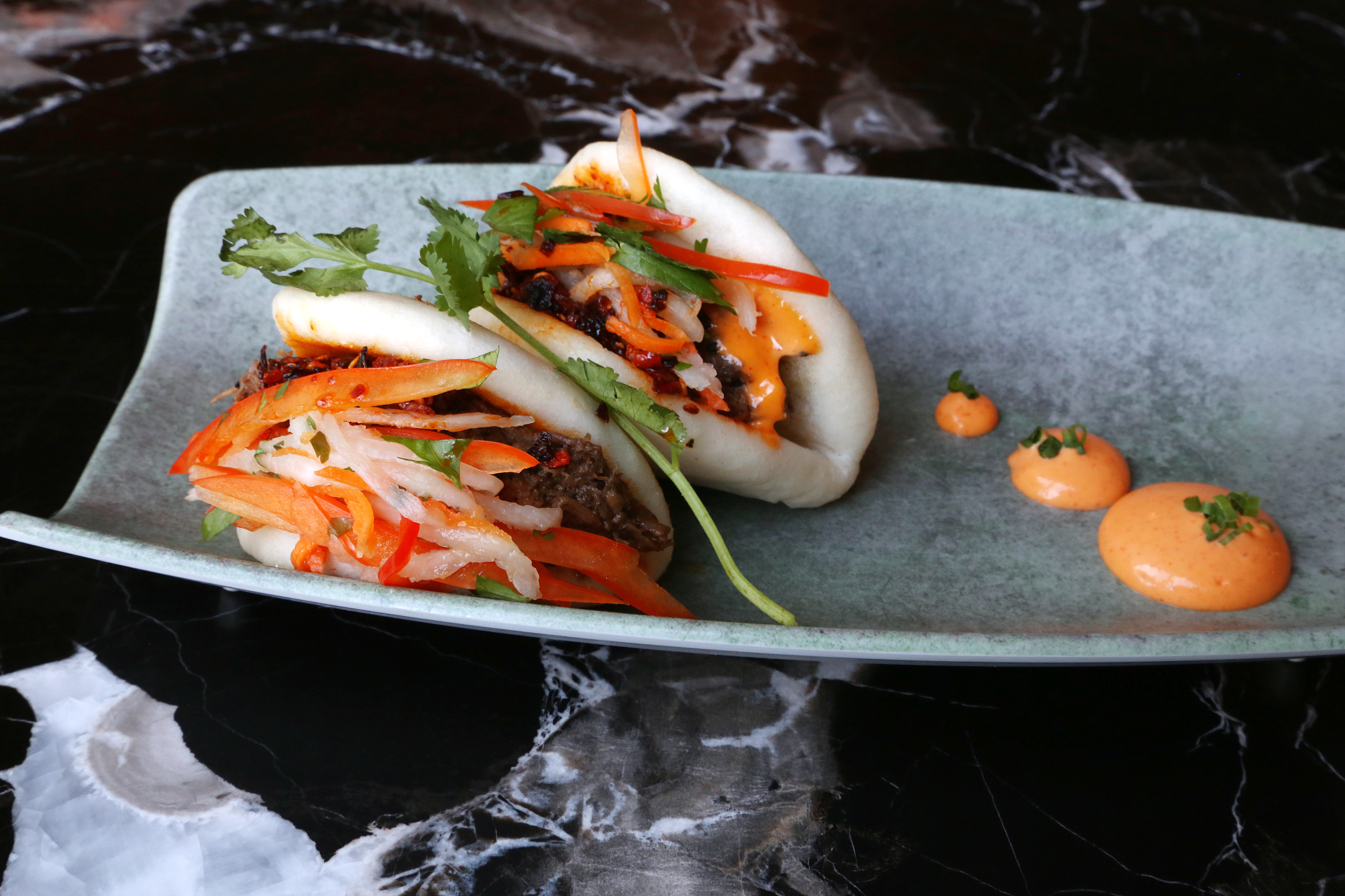Steamed buns with braised short ribs are a menu highlight. SCOTT KEELER | Tampa Bay Times Steamed buns with braised short ribs are a menu highlight. SCOTT KEELER | Tampa Bay Times