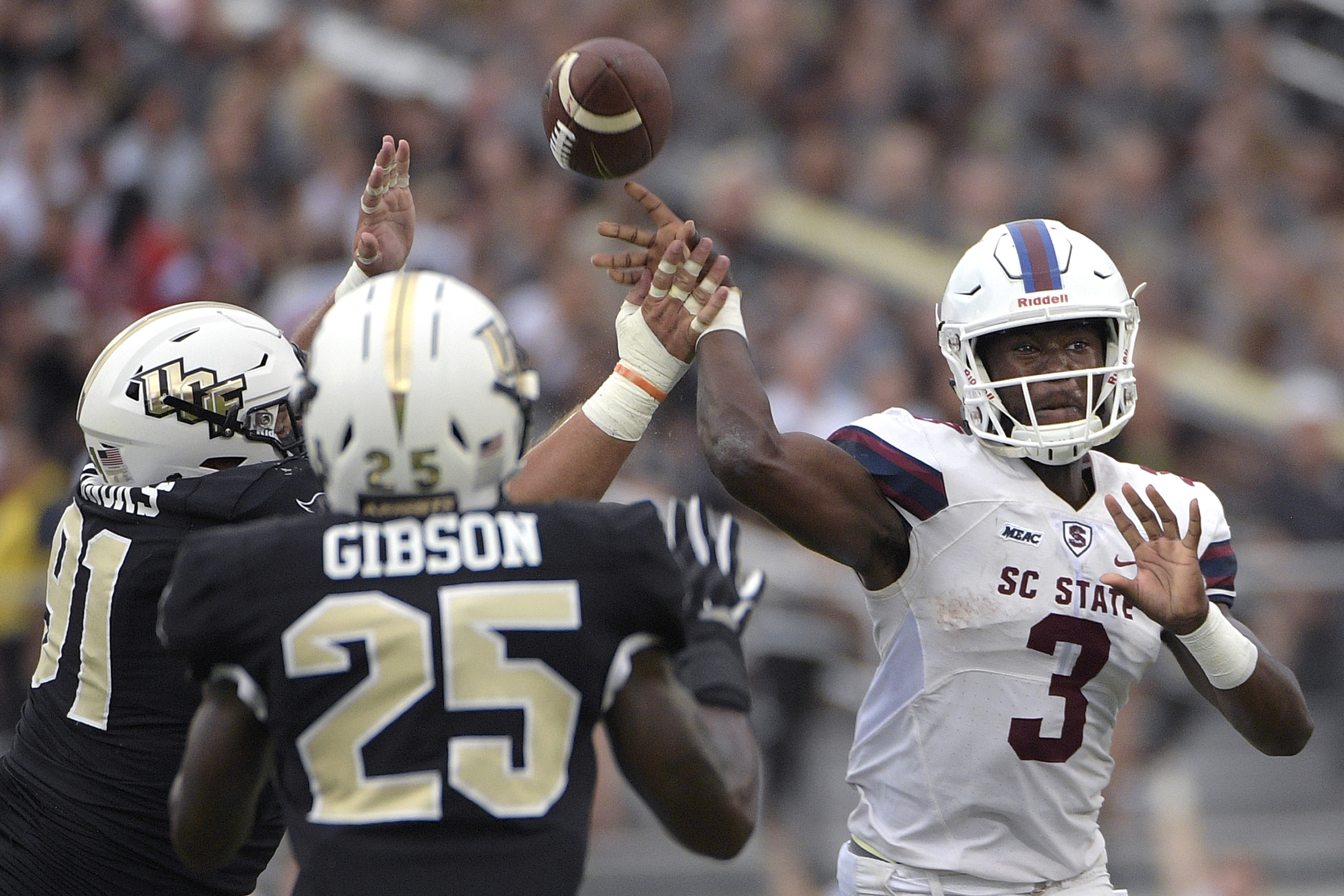 UCF defensive lineman Joey Connors (91) deflects the ball on a pass thrown by South Carolina State quarterback Tyrece Nick (3) as defensive back Kyle Gibson (25) watches during a game last season. Phelan M. Ebenhack | AP UCF defensive lineman Joey Connors (91) deflects the ball on a pass thrown by South Carolina State quarterback Tyrece Nick (3) as defensive back Kyle Gibson (25) watches during a game last season. Phelan M. Ebenhack | AP