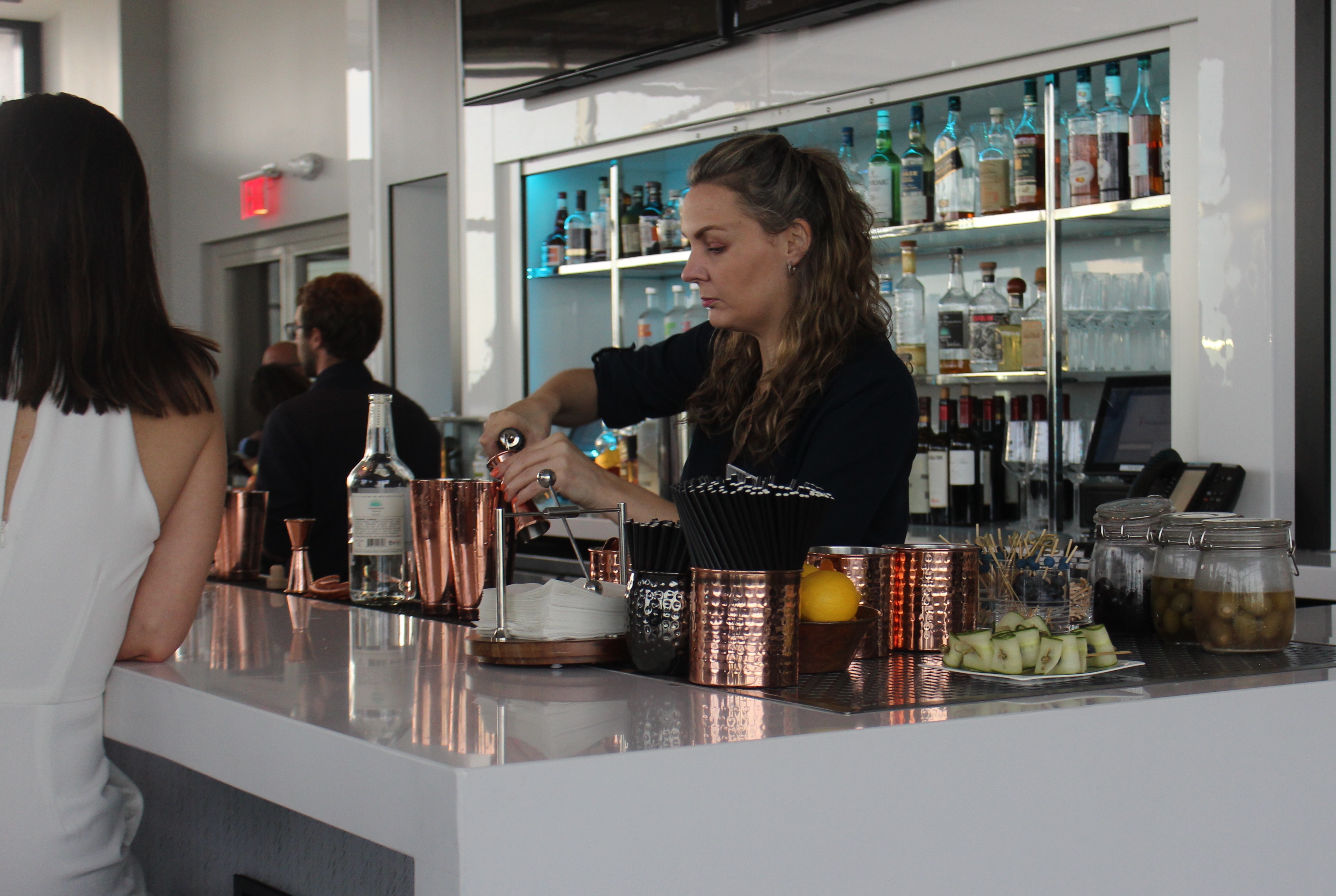 Bartenders mix cocktails at the Current Hotel's rooftop bar, the Rox. Sara DiNatale | Tampa Bay Times Bartenders mix cocktails at the Current Hotel's rooftop bar, the Rox. Sara DiNatale | Tampa Bay Times