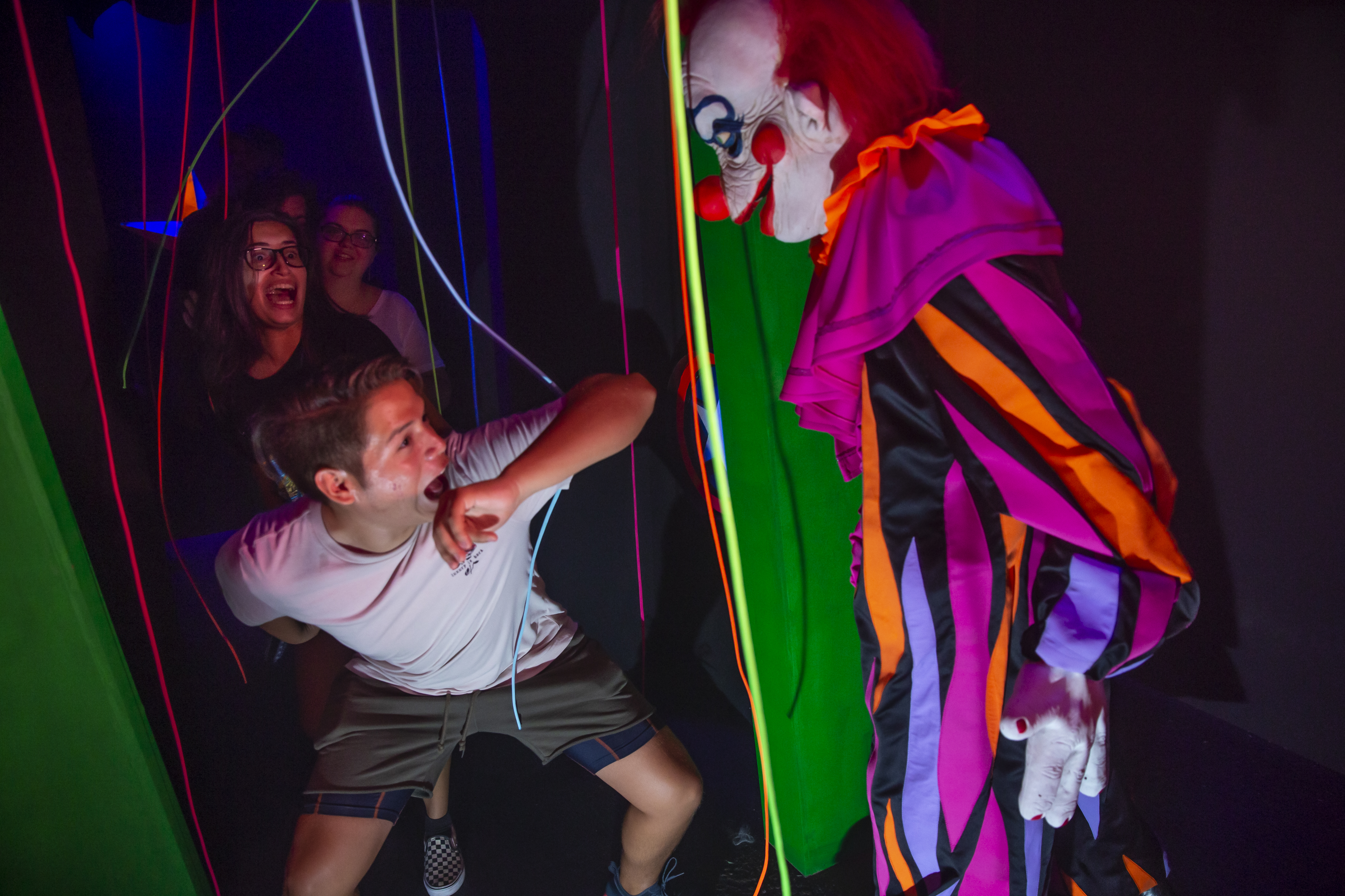 Halloween Horror Nights team members walk through a preview of the Killer Klowns From Outer Space haunted house at Halloween Horror Nights 2019. Willie Allen Jr. | Courtesy of Universal Orlando Halloween Horror Nights team members walk through a preview of the Killer Klowns From Outer Space haunted house at Halloween Horror Nights 2019. Willie Allen Jr. | Courtesy of Universal Orlando