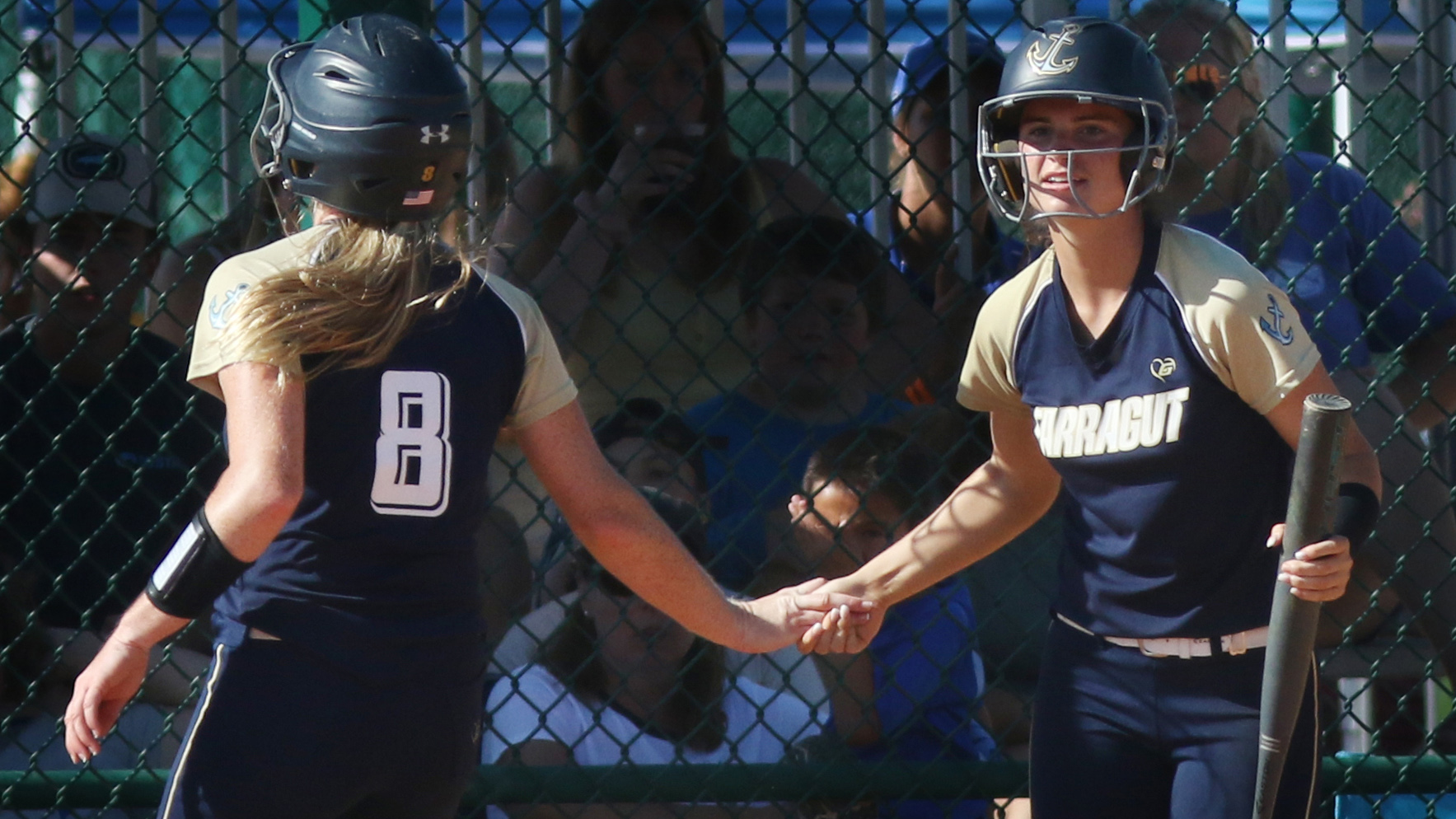 Admiral Farragut junior Alyssa Rano, left, gets a high five from Hayley Saylor moments after scoring a run. (SCOTT PURKS | Special to the Times) Admiral Farragut junior Alyssa Rano, left, gets a high five from Hayley Saylor moments after scoring a run. (SCOTT PURKS | Special to the Times)