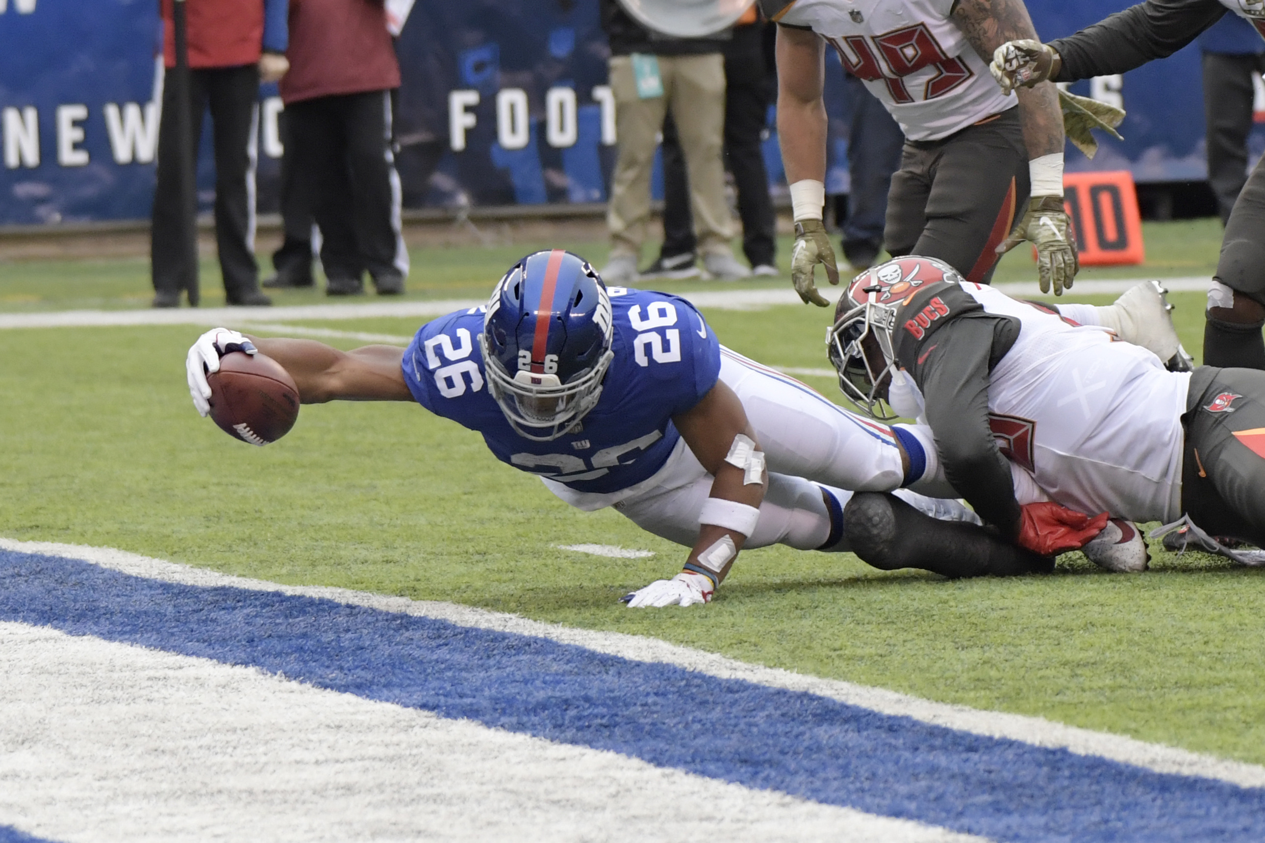 New York Giants' Saquon Barkley, left, scores a touchdown during the first half of an NFL football game against the Tampa Bay Buccaneers, Sunday, Nov. 18, 2018, in East Rutherford, N.J. (AP Photo/Bill Kostroun) Bill Kostroun | AP New York Giants' Saquon Barkley, left, scores a touchdown during the first half of an NFL football game against the Tampa Bay Buccaneers, Sunday, Nov. 18, 2018, in East Rutherford, N.J. (AP Photo/Bill Kostroun) Bill Kostroun | AP