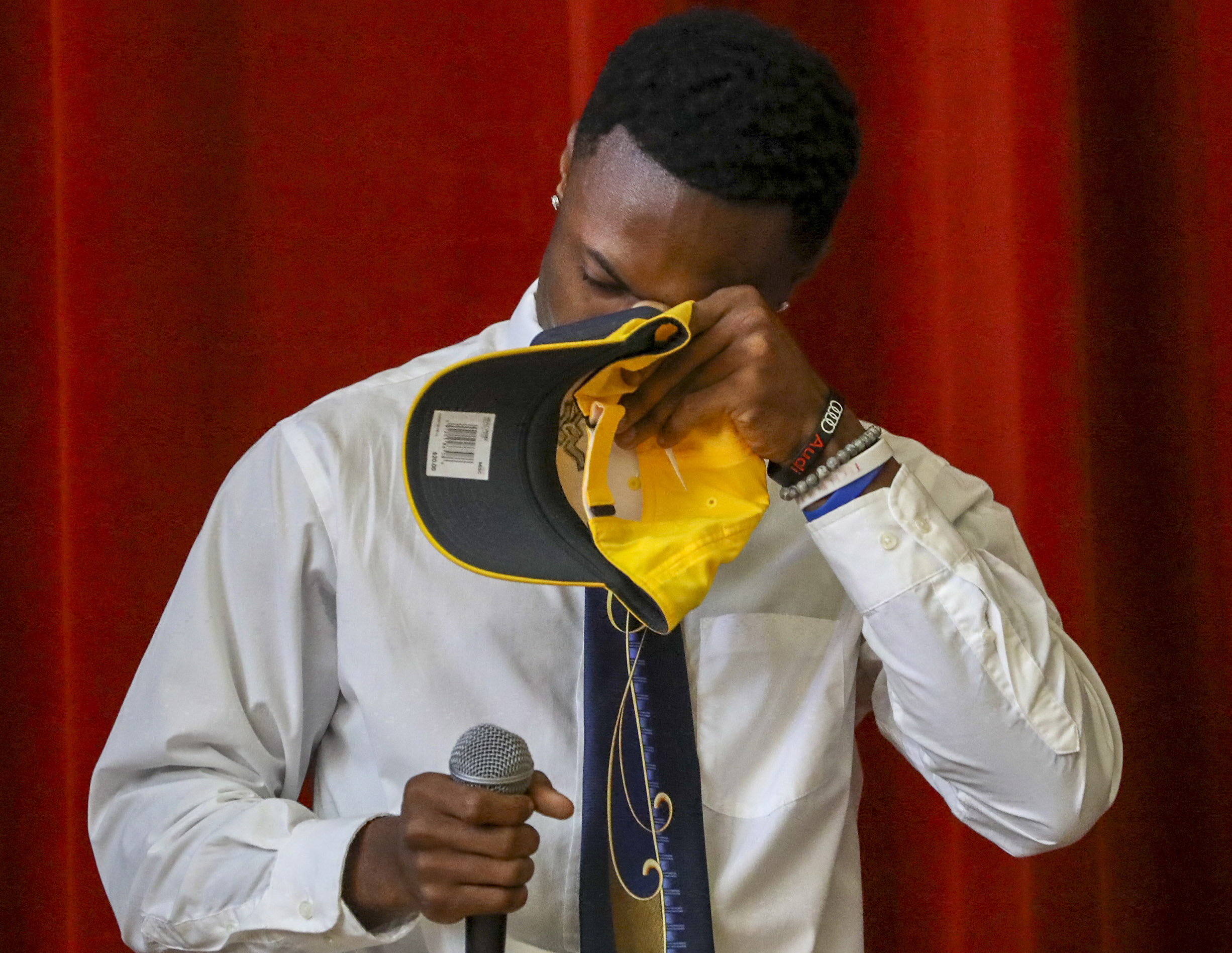 Terrence Dotson wipes his eyes while becoming emotional talking about his mother during signing day. (CHRIS URSO | Times) Terrence Dotson wipes his eyes while becoming emotional talking about his mother during signing day. (CHRIS URSO | Times)