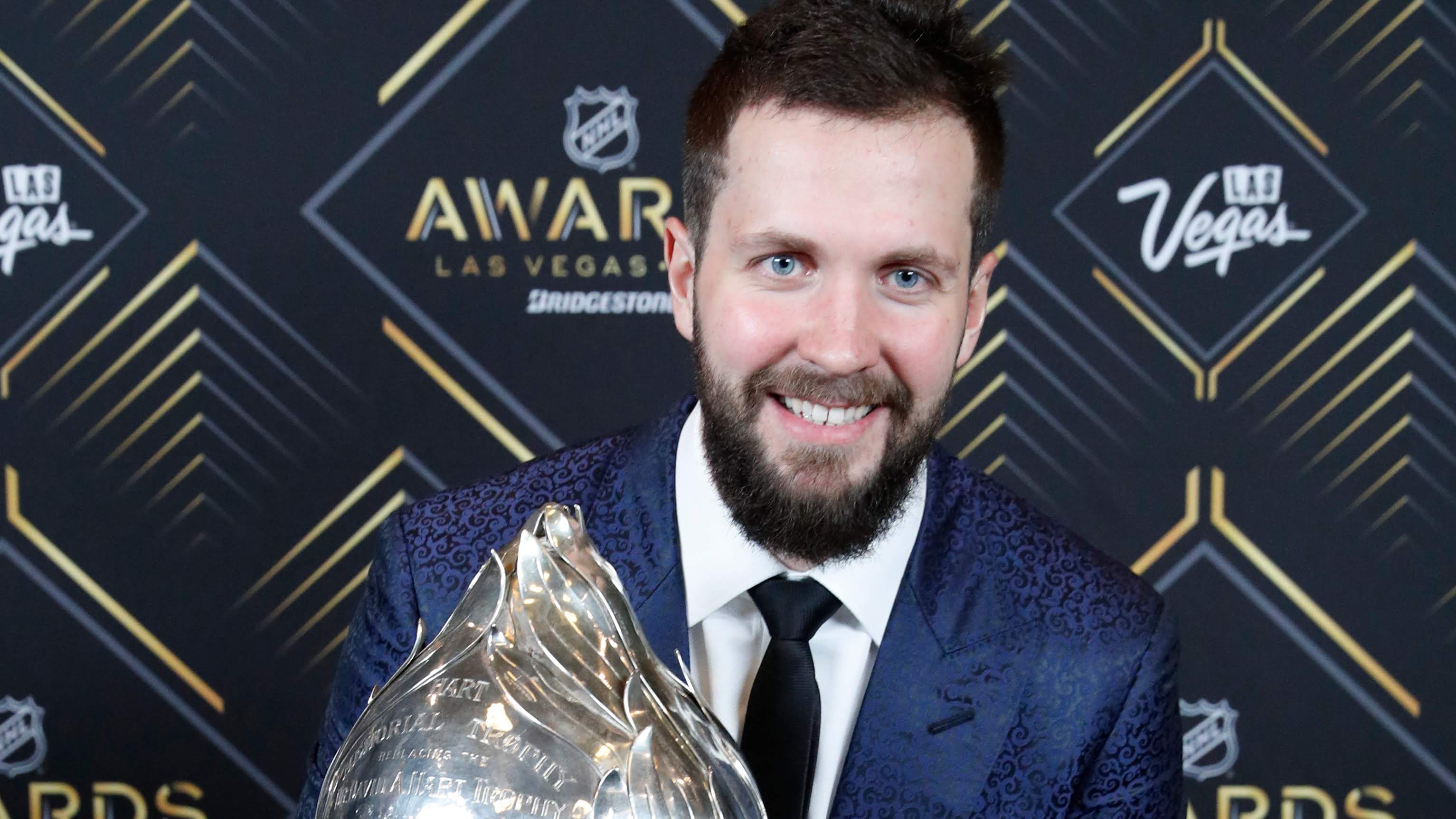 Tampa Bay Lightning's Nikita Kucherov poses with the Hart Memorial Trophy. (AP Photo/John Locher) Tampa Bay Lightning's Nikita Kucherov poses with the Hart Memorial Trophy. (AP Photo/John Locher)
