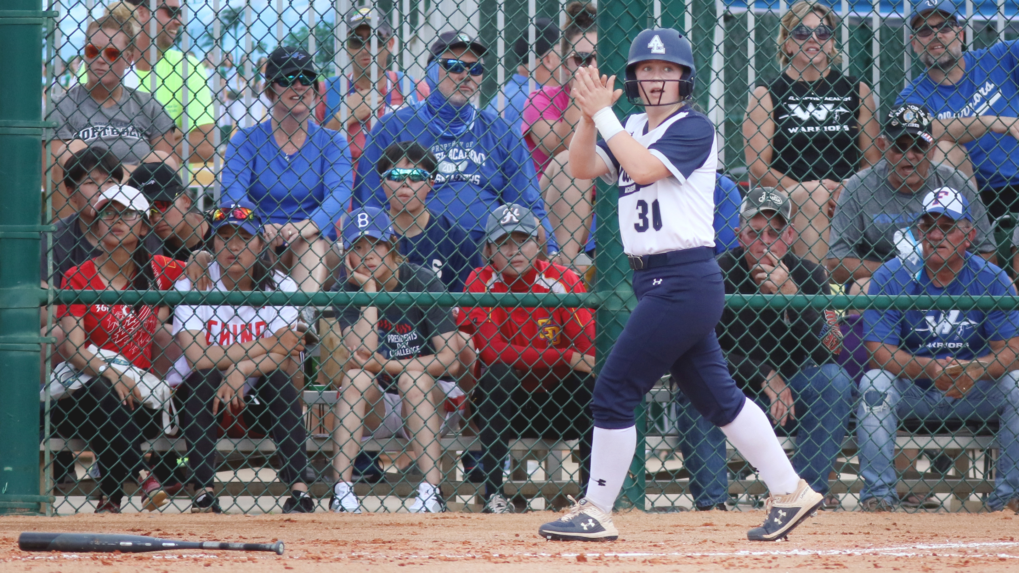 Academy at the Lakes eighth grader Caitlin Blankenship claps after crossing the plate, and then watching more runners cross. (SCOTT PURKS | Special to the Times) Academy at the Lakes eighth grader Caitlin Blankenship claps after crossing the plate, and then watching more runners cross. (SCOTT PURKS | Special to the Times)