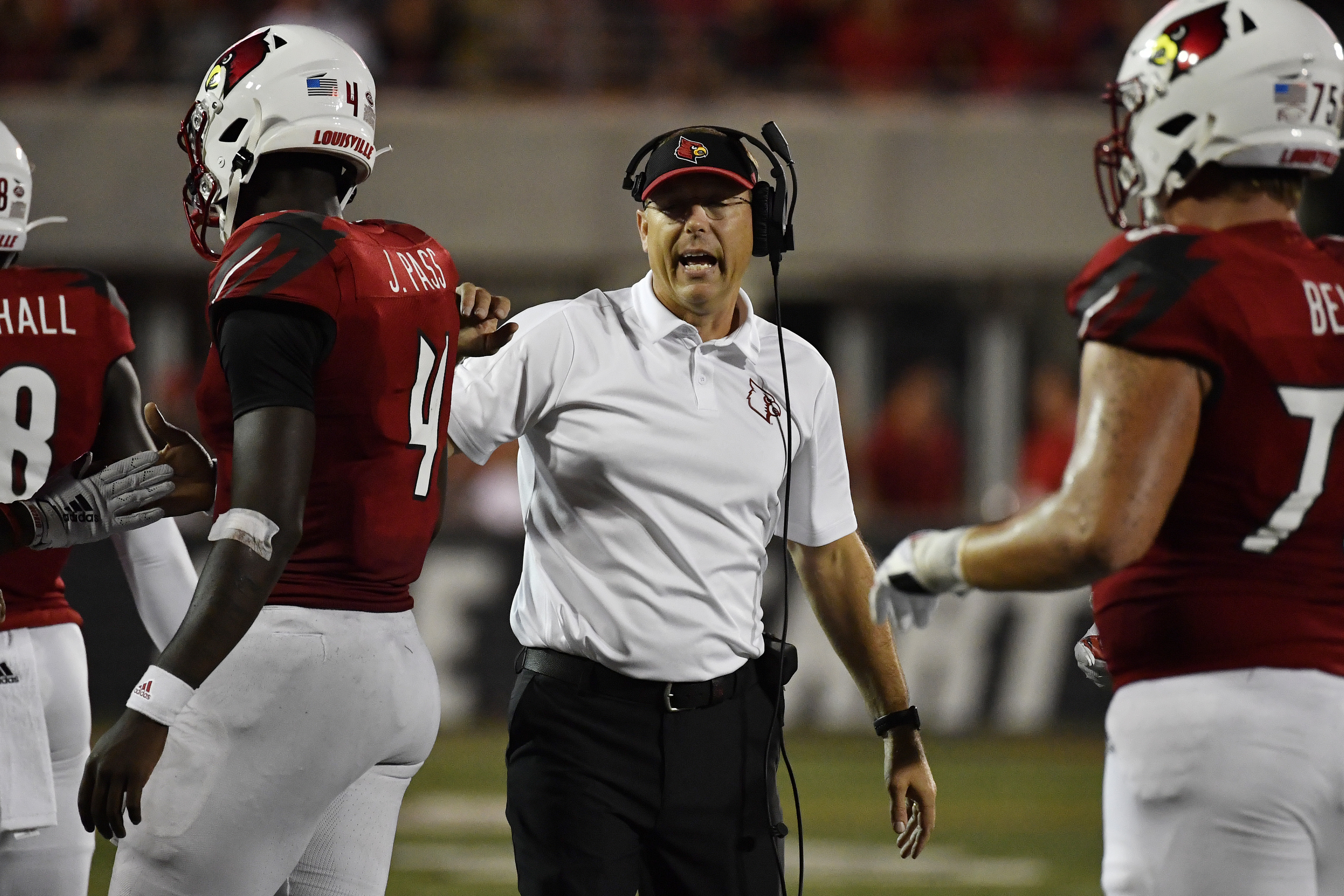 Louisville coach Scott Satterfield talks to his team as players leave the field on Sept. 7. Timothy D. Easley | AP Louisville coach Scott Satterfield talks to his team as players leave the field on Sept. 7. Timothy D. Easley | AP