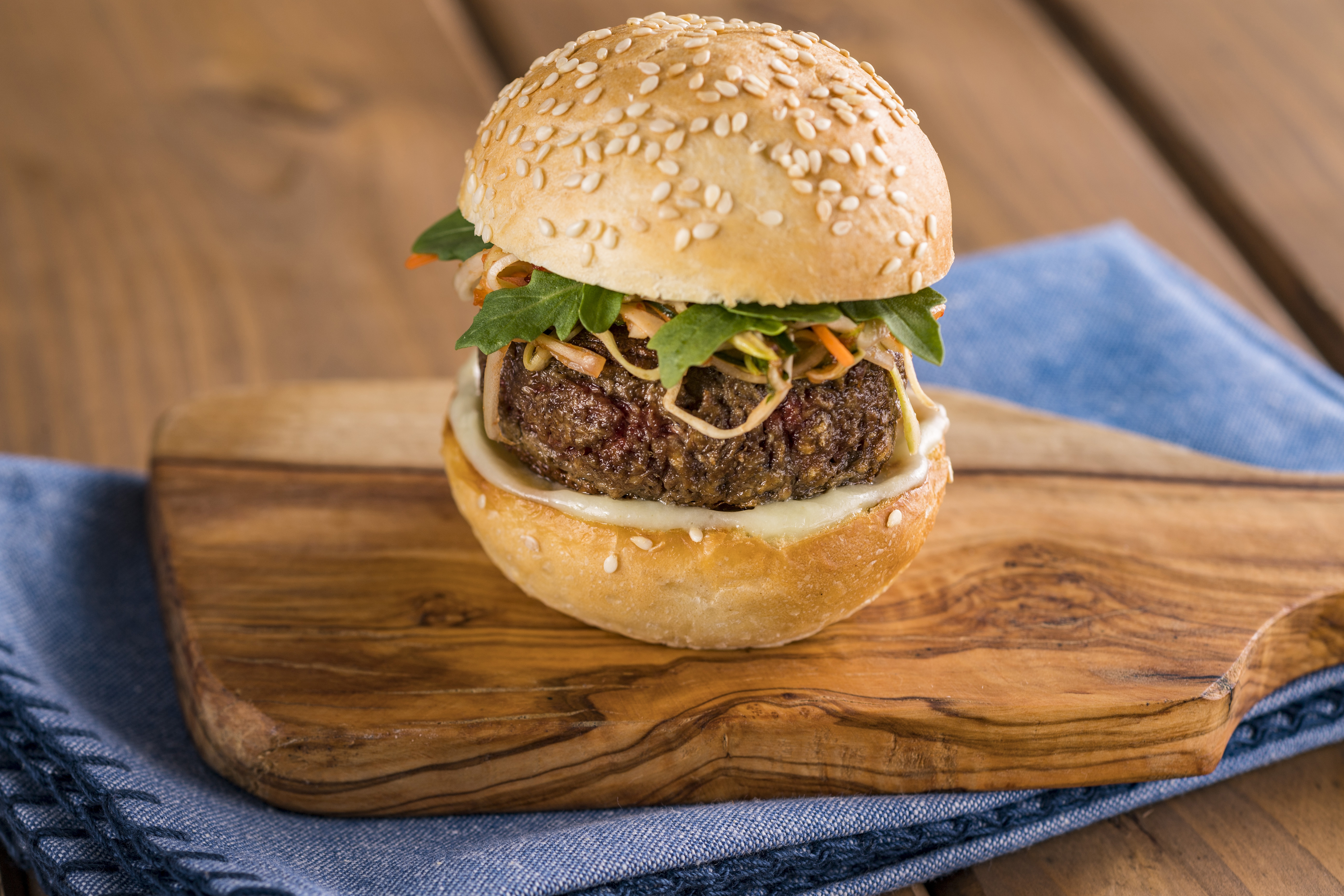 An Impossible slider with wasabi cream and spicy Asian slaw on a sesame seed bun is served at Earth Eats. Walt Disney World An Impossible slider with wasabi cream and spicy Asian slaw on a sesame seed bun is served at Earth Eats. Walt Disney World