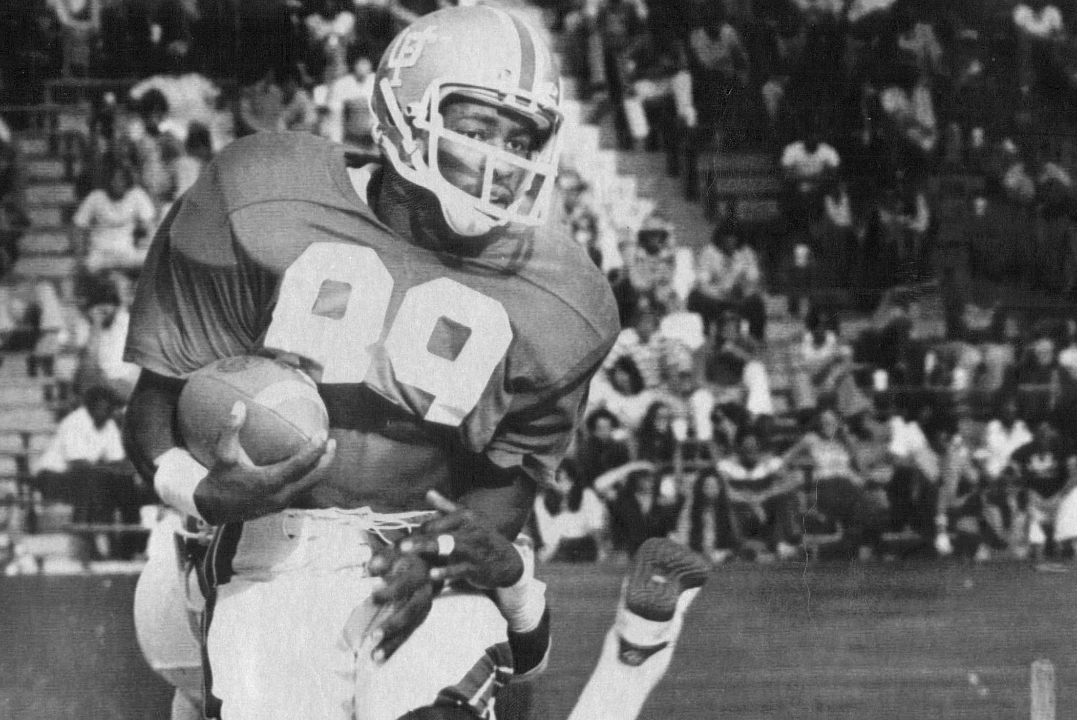 Florida's Wes Chandler sidesteps a University of Utah defensive player. (Times, 1977) Florida's Wes Chandler sidesteps a University of Utah defensive player. (Times, 1977)