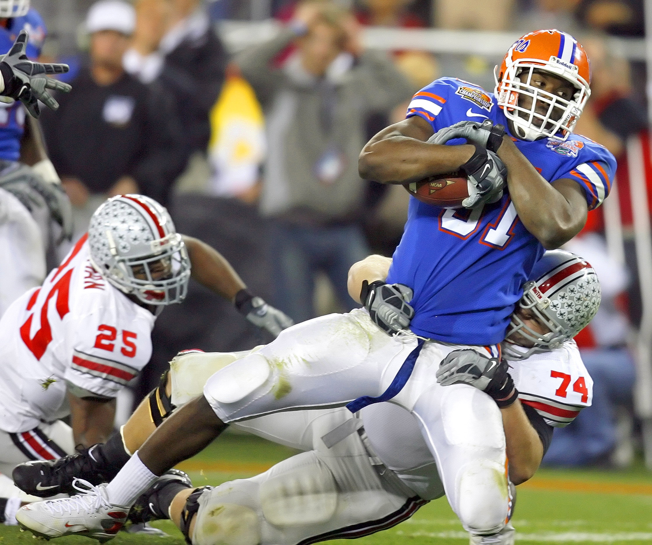 Florida's Derrick Harvey is tackled by Ohio State's Kirk Barton after Harvey's second-quarter fumble recovery in the BCS National Championship Game in Glendale, Ariz. (JAMES BORCHUCK | Times 2007) Florida's Derrick Harvey is tackled by Ohio State's Kirk Barton after Harvey's second-quarter fumble recovery in the BCS National Championship Game in Glendale, Ariz. (JAMES BORCHUCK | Times 2007)