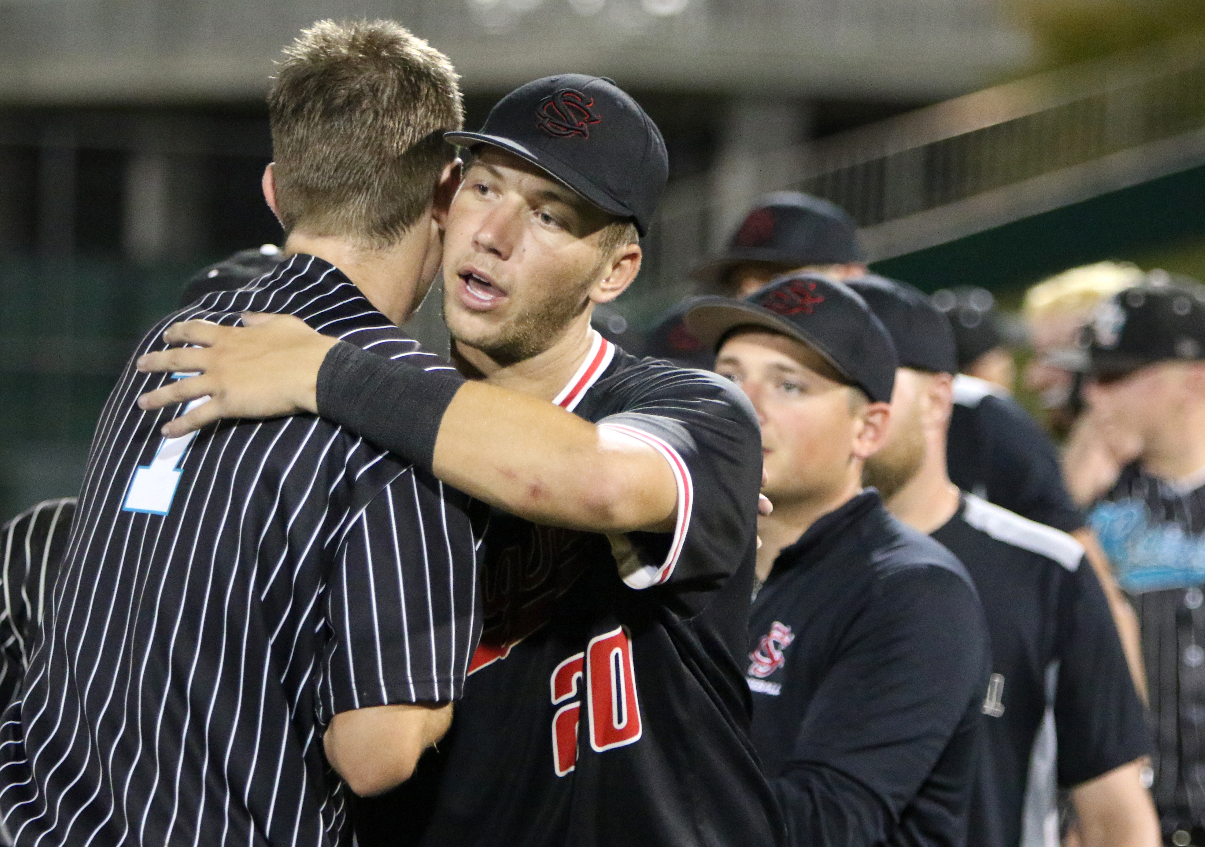 Plenty of good sportsmanship to go around between neighboring schools Strawberry Crest and Plant City. After Plant City defeated the Chargers 3-1, Crest rightfielder Ben Pues gives a sincere hug of congratulations to every member of the Raiders. (SCOTT PURKS | Special to the Times) Plenty of good sportsmanship to go around between neighboring schools Strawberry Crest and Plant City. After Plant City defeated the Chargers 3-1, Crest rightfielder Ben Pues gives a sincere hug of congratulations to every member of the Raiders. (SCOTT PURKS | Special to the Times)
